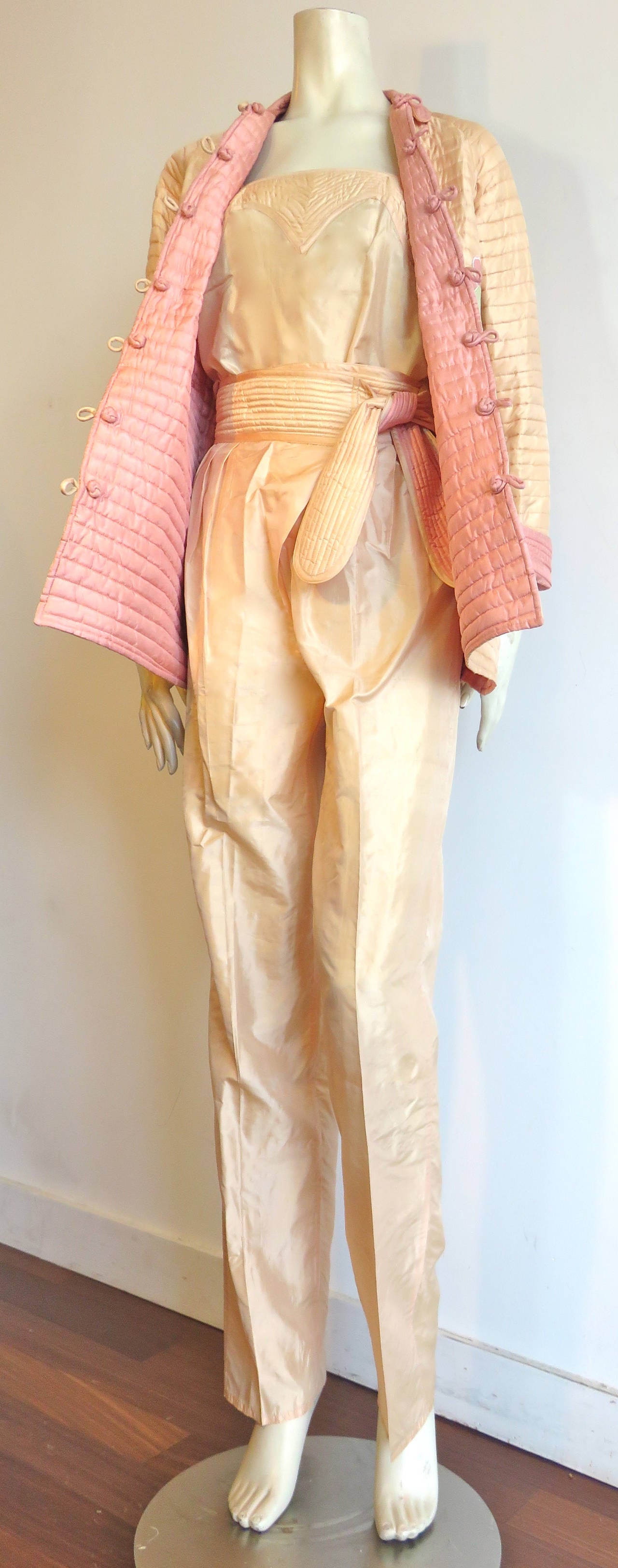 Excellent condition, 1970's BILL TICE 3pc. silk ensemble, comprised of reversible, quilted jacket, silk camisole, and belted pants.

The quilted jacket is reversible from pale peach to mauve with floral, 'morning glory' appliqué detail on back. 