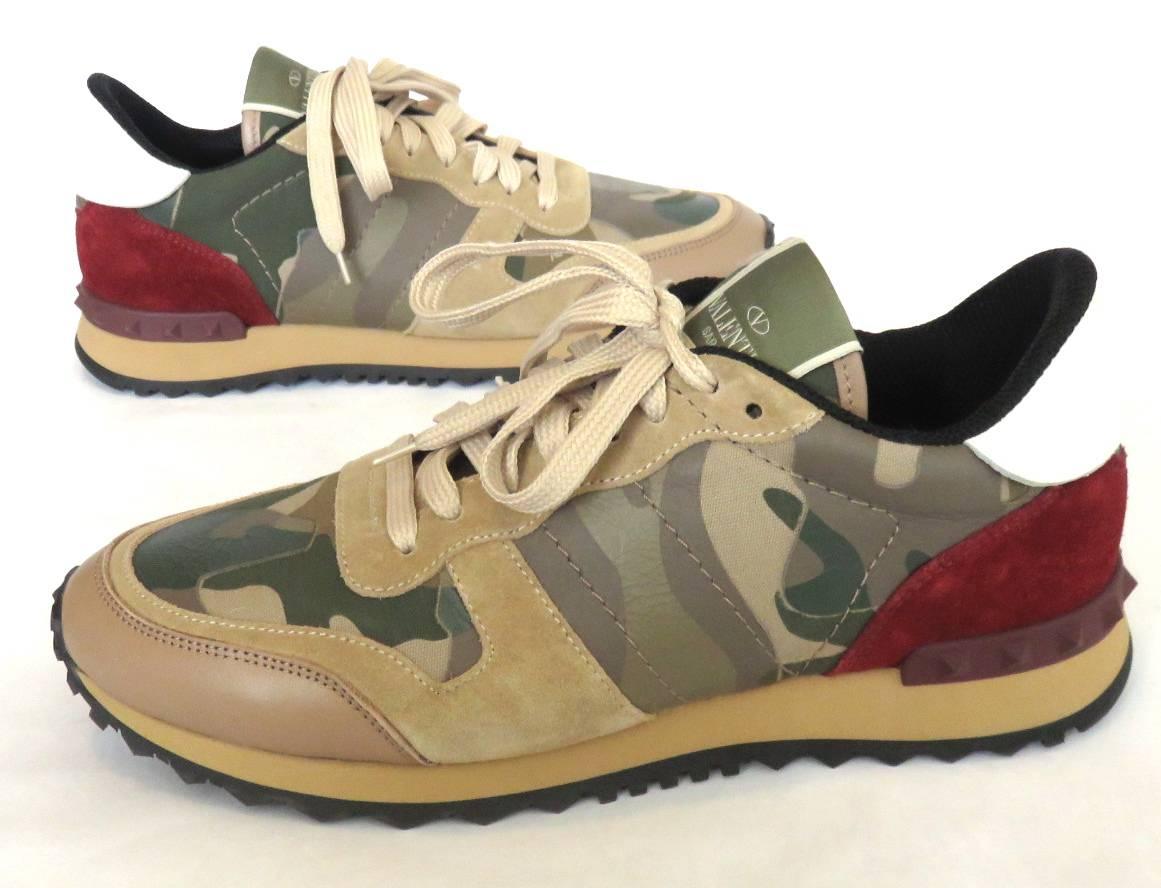 Worn once, 'like new' condition, VALENTINO GARAVANI, Men's Rockstud Camouflage sneakers.

Army green, camouflage leather appliqué atop printed canvass, with suede leather skin paneling.  Red suede panel with white, leather, top flap at