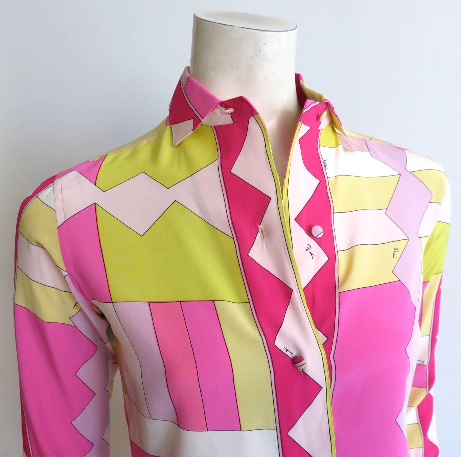 Excellent condition, 1960's EMILIO PUCCI Signature printed silk shirt in bright shades of pink, and yellow. 

Zig-zag printed collar, front placket, cuffs, and hem.

Self-fabric covered buttons.

*MEASUREMENTS*

Suits a modern-day US size