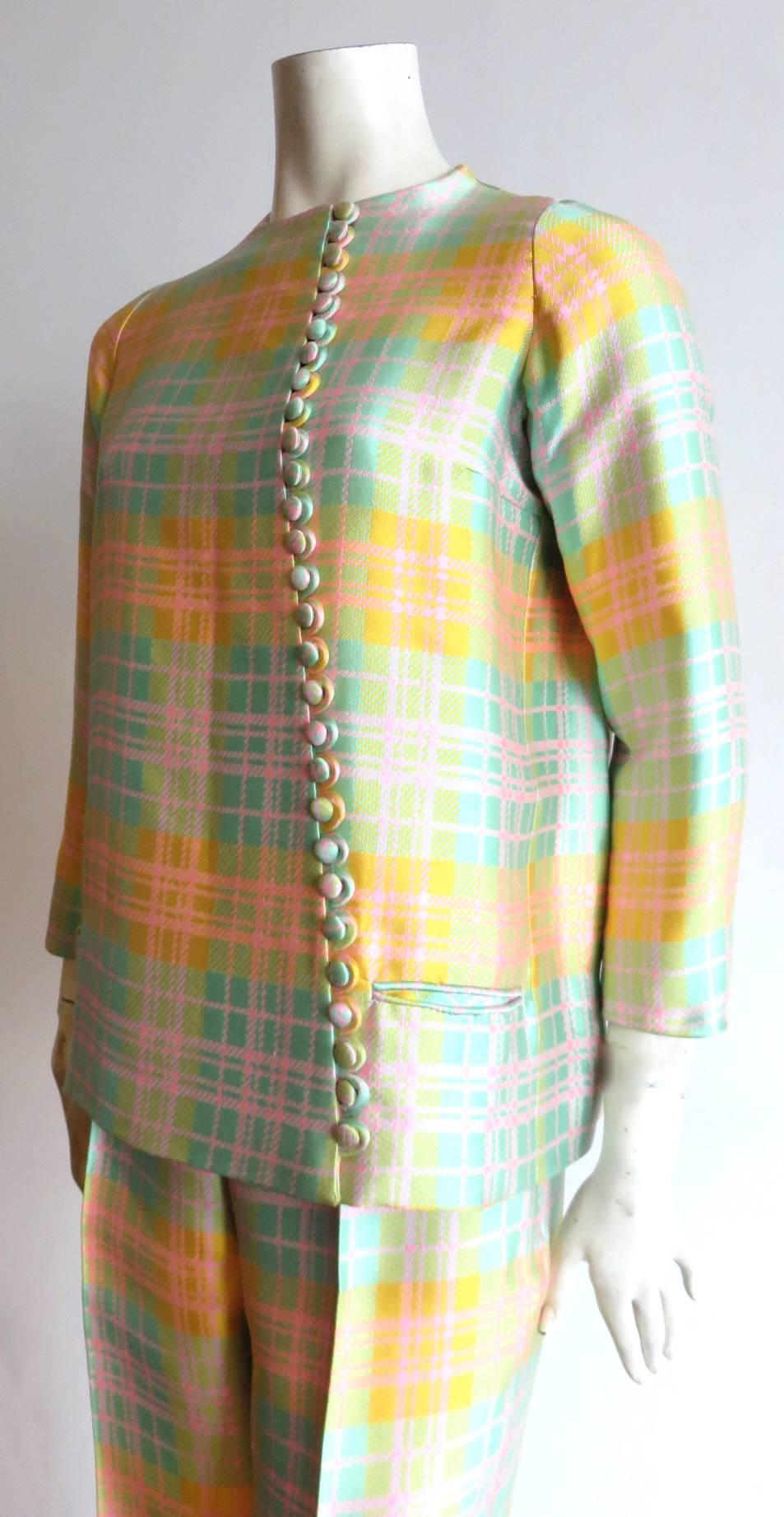 Wonderful, 1970's DONALD BROOKS, luminous silk jacket & pant set.

Couture-quality construction, of luxurious silk fabric in delightful, pastel color plaid.  

Loop button closures along front.

The jacket has a flared, 'A'-line silhouette