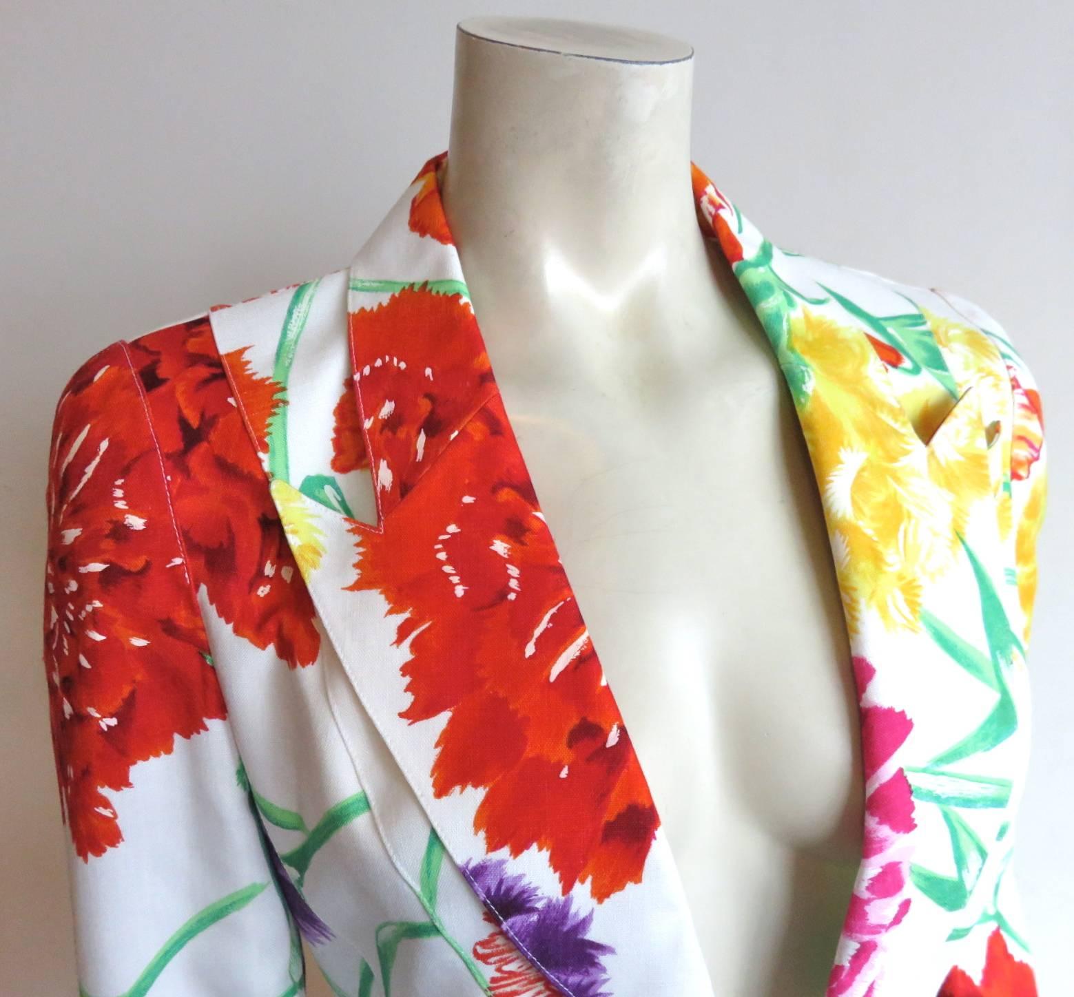 Mint condition, with no signs of wear or age, 1980's, THIERRY MUGLER PARIS painted floral jacket.

Colorful, floral print with hand painted accents atop white linen cloth base.

Signature, 'wasp-waist' silhouette with razor-sharp, peak-lapels,