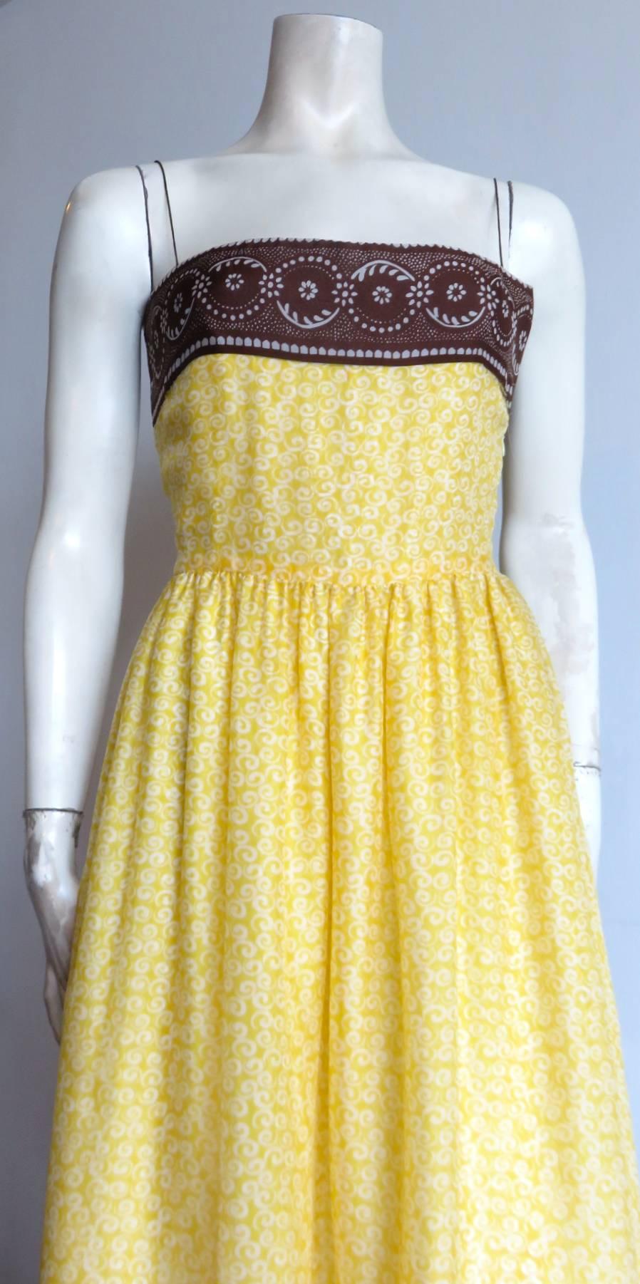 Gorgeous, 1990's, OSCAR DE LA RENTA printed silk georgette dress.

This wonderful dress features double-layered, sunshine yellow, and ivory printed, spiral artwork at main dress body with coca brown, and ivory, sunflower dotted print borders at