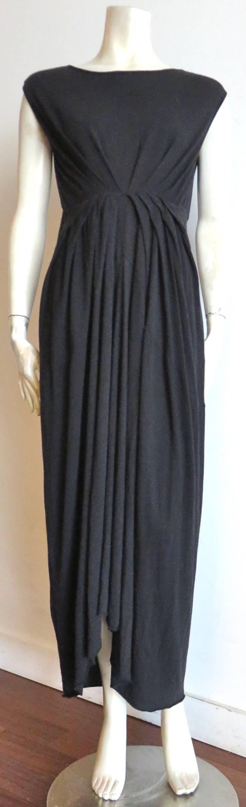 New RICK OWENS Wool angora jersey dress.

Stretchy black knit fabrication featuring, 'sunburst' style pleated design at front, empire waist.

Boatneck opening.

New with tags.

Made in Italy, as labeled.

*MEASUREMENTS*

IT LABEL 40, US