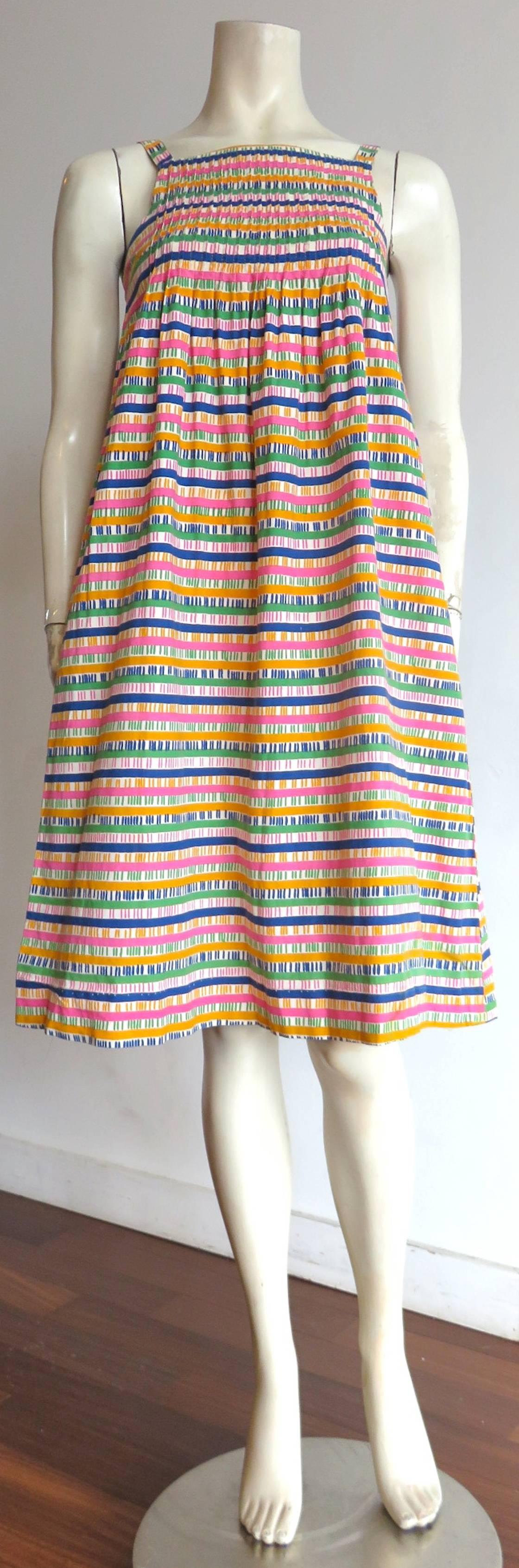 1970's MERIMEKKO, printed cotton sun dress.

Multi-color, 'ladder' stripe printed artwork.

Tucking construction at front and back top panel.

Empire-style waistline with a flared, 'A'-line silhouette.

Made in