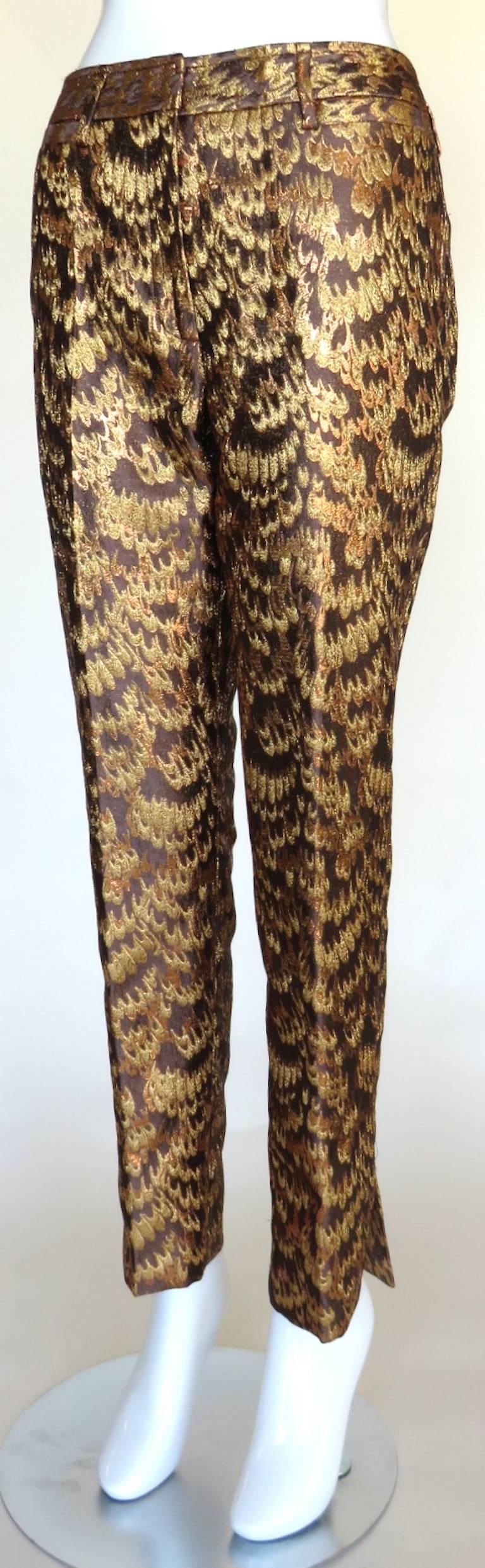 Worn once, excellent condition, DOLCE & GABBANA, metallic, golden brocade feather jacquard pants.

Ultra-lux fabrication featuring woven, feather artwork jacquard.

Tapered leg, flat front style with side slit openings at bottom