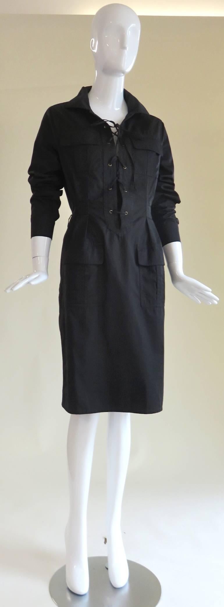 Great condition, YVES SAINT LAURENT Tom Ford Black Cotton Safari Dress.

Iconic safari, lace-up neckline front design.

Twin chest, and waist level flap pockets.

Cotton fabrication.

Made in Italy, as labeled. 

*MEASUREMENTS &