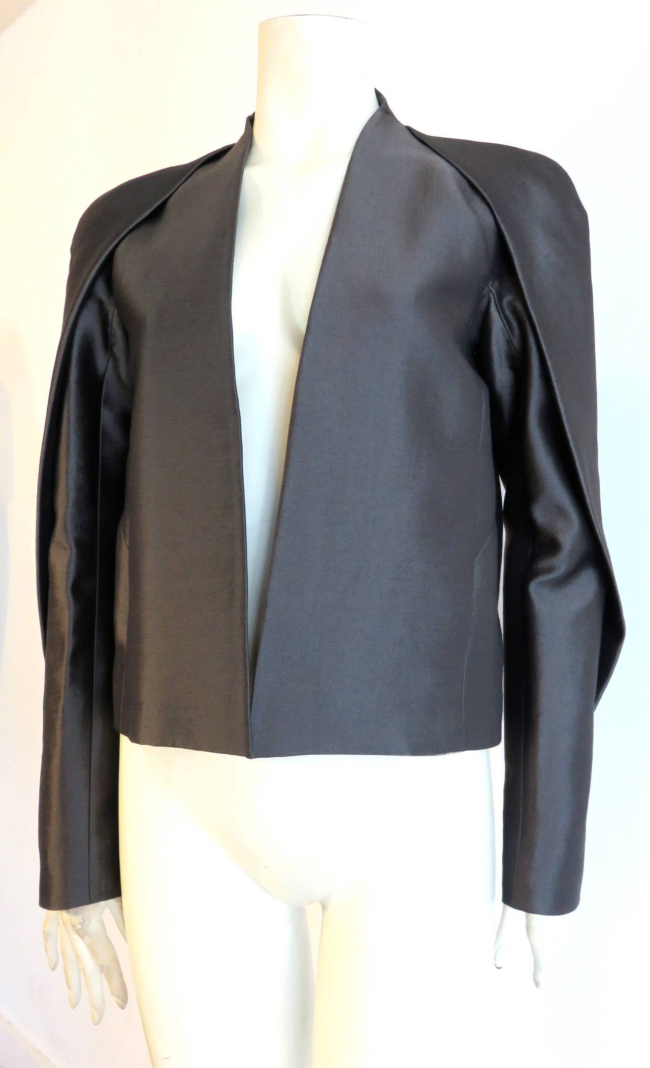 New with tag, HAIDER ACKERMANN Durell Anthracite jacket.

This stunning jacket features a high-shine, tonic, wool & silk, twill weave fabrication.

Gorgeous fold over, origami-style pleat detail at the shoulder cap, and sleeve
