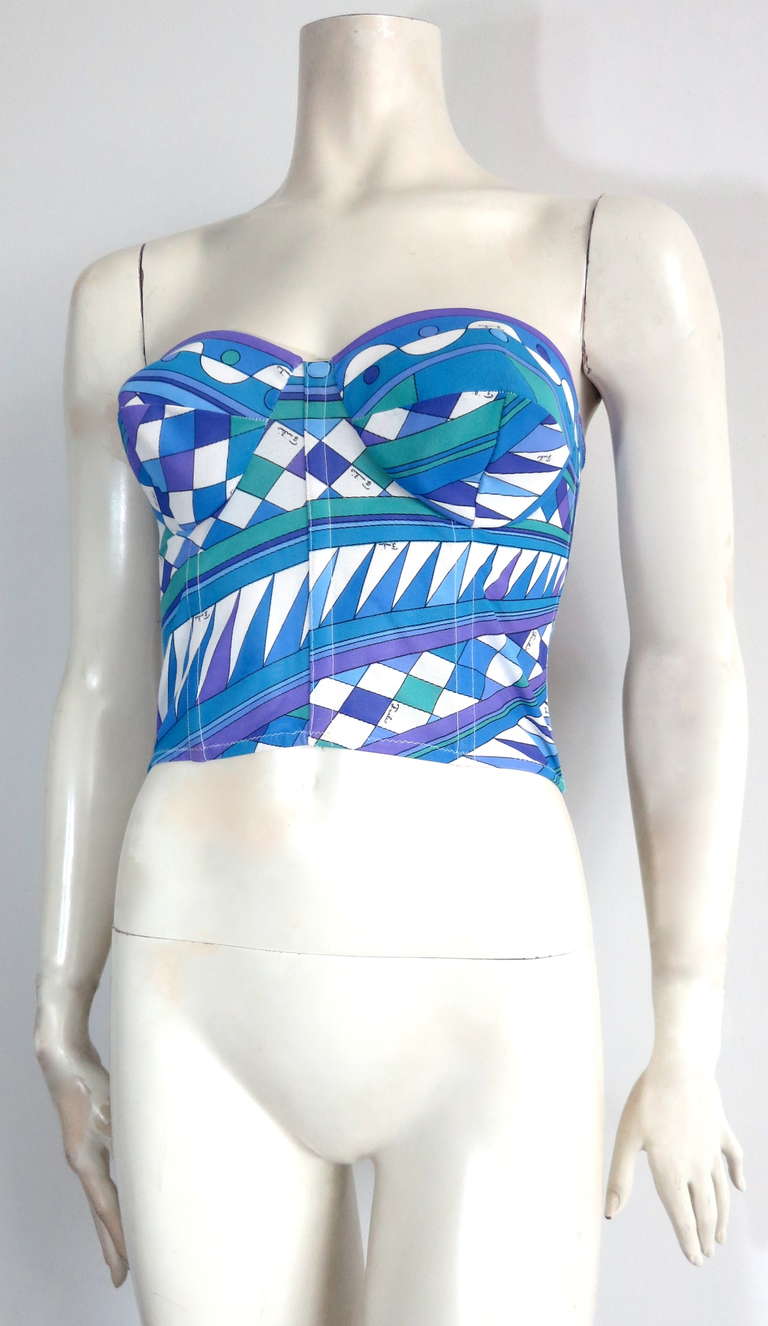 Vintage / unworn EMILIO PUCCI Signature printed bustier.

This beautiful, unworn bustier was designed by Emilio Pucci in Italy, during the 1960's.

Signed, geometric printed mesh fabrication with internal boning construction, and velcro back