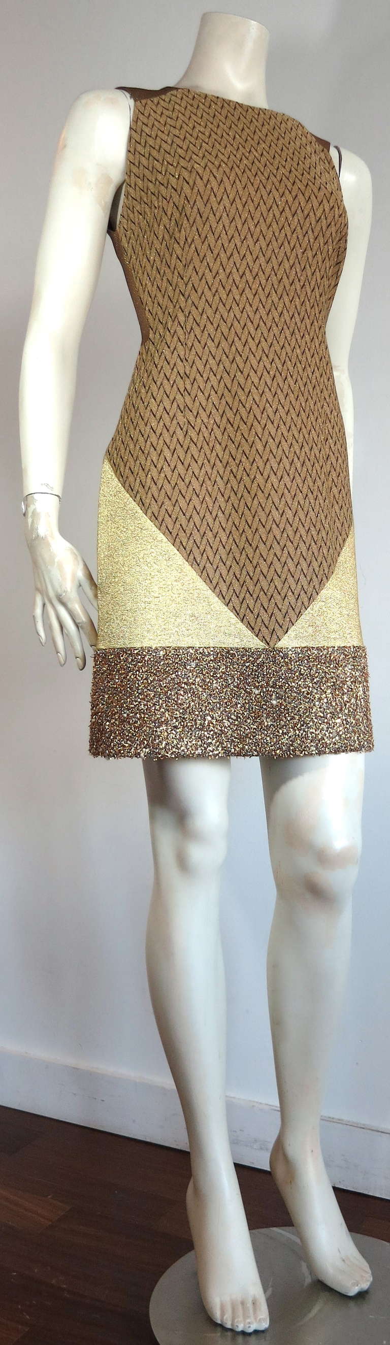 New MISSONI Metallic gold patchwork cocktail dress.

This brand new with tag dress was designed by Angela Missoni recently in Italy.

The dress features angled seaming construction utilizing four different, ultra-lux, metallic gold stretch