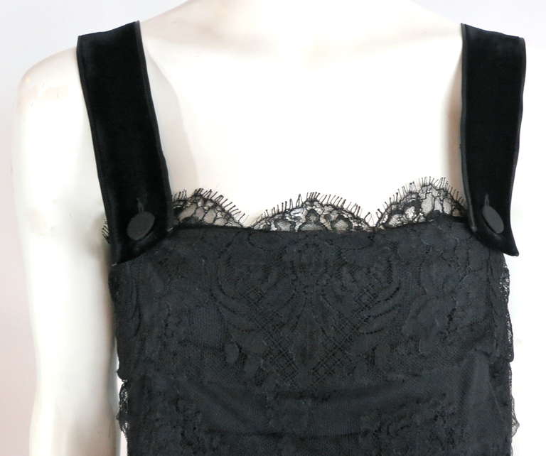 LANVIN PARIS  Tiered black lace dress.

This lovely dress was designed by Alber Elbaz for 2006, and is made in France, as labeled.

This beautiful dress  features detailed floral lace overlay which is folded in a horizontal, pleat construction