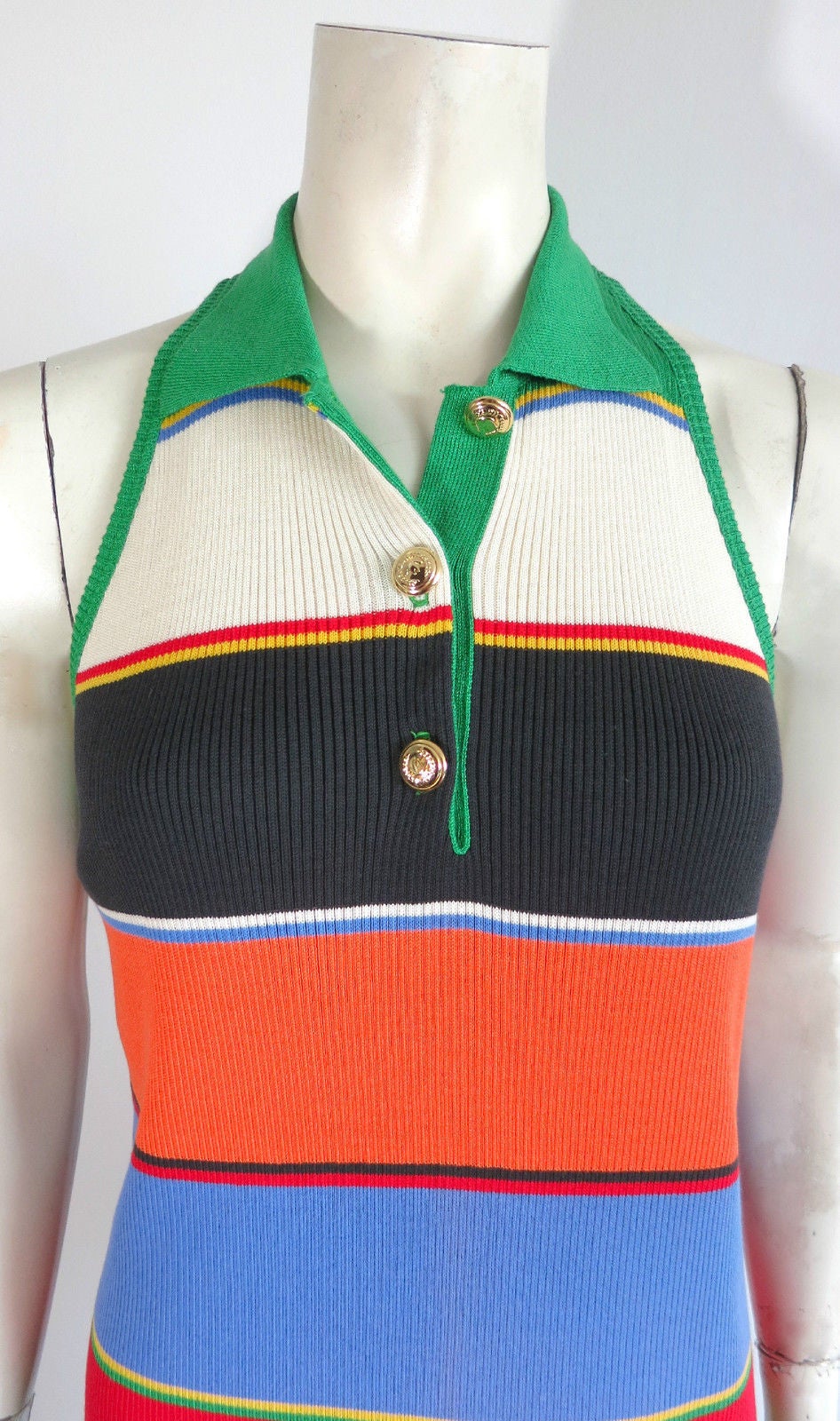 Never worn with original tag, 1990's MOSCHINO multi-color rib knit dress

Stetson laurel wreath engraved metal buttons at from with solid green, rib-knit collar and armhole binding

Made in Italy, as labeled

Unworn, with the original tag