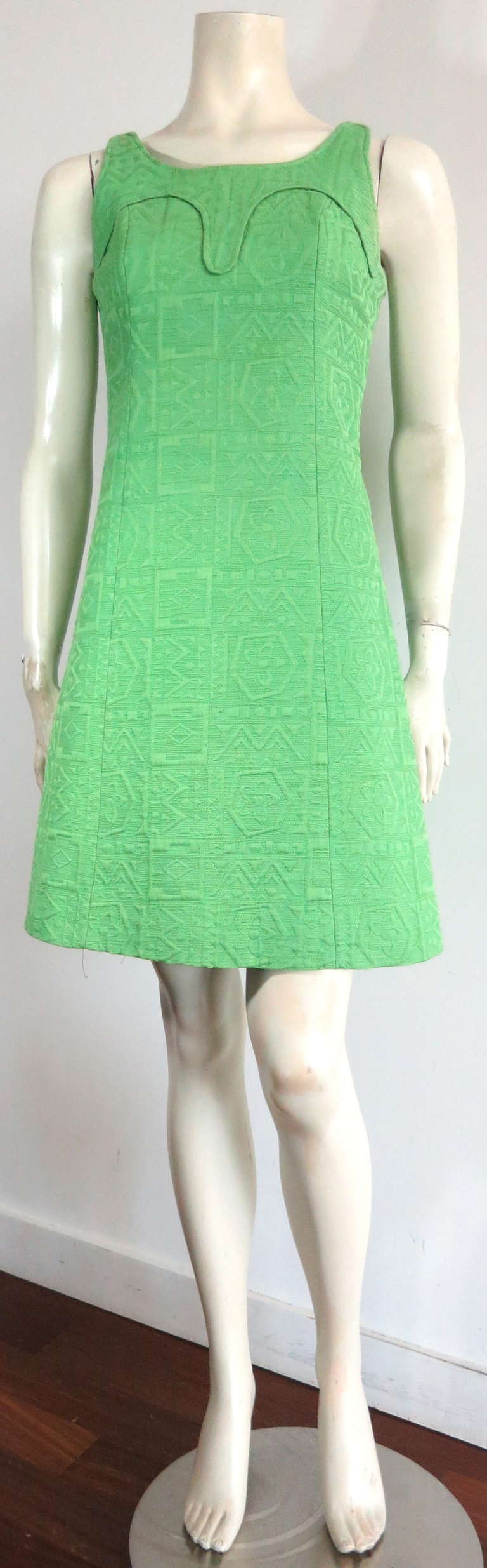 Vintage LOUIS FERAUD Mod dress with shaped yoke detail front.

The dress was designed by Louis Feraud in the 1960's in France.  

The base cloth is a thick, tapestry-weight fabric that features a geometric and floral woven