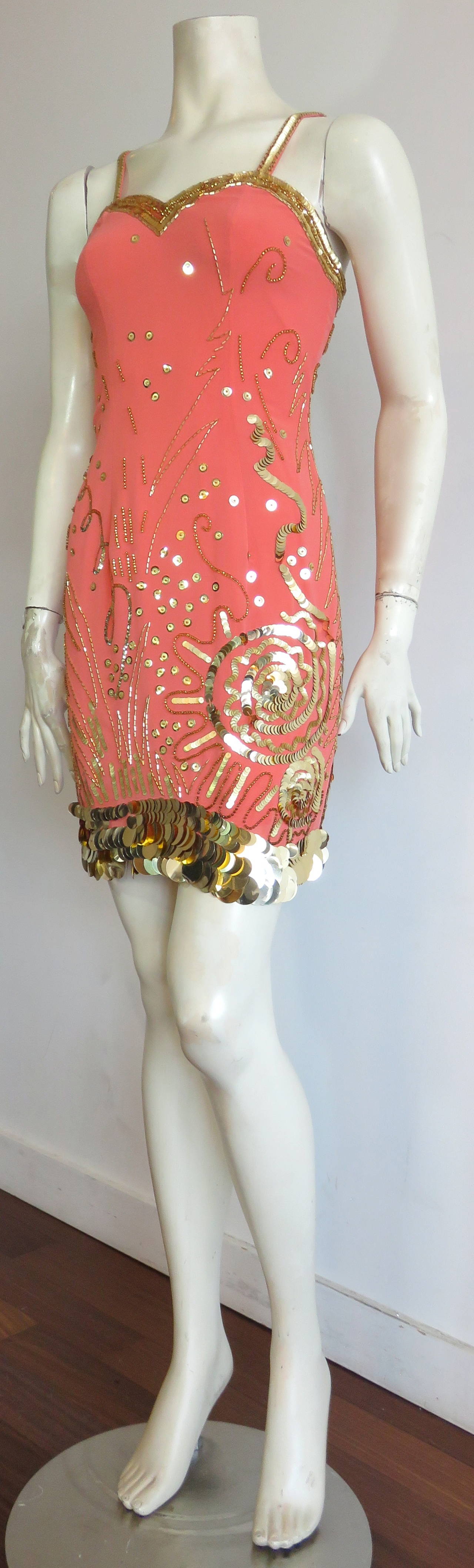 Fabulous, 1980's, FABRICE, embellished, silk cocktail dress.

Really amazing, metallic gold, beaded, and sequin, asymmetric design with oversized, paillette hemline.  Gorgeous, coral, 100% silk crepe, base fabrication.

Beaded, sweet-heart