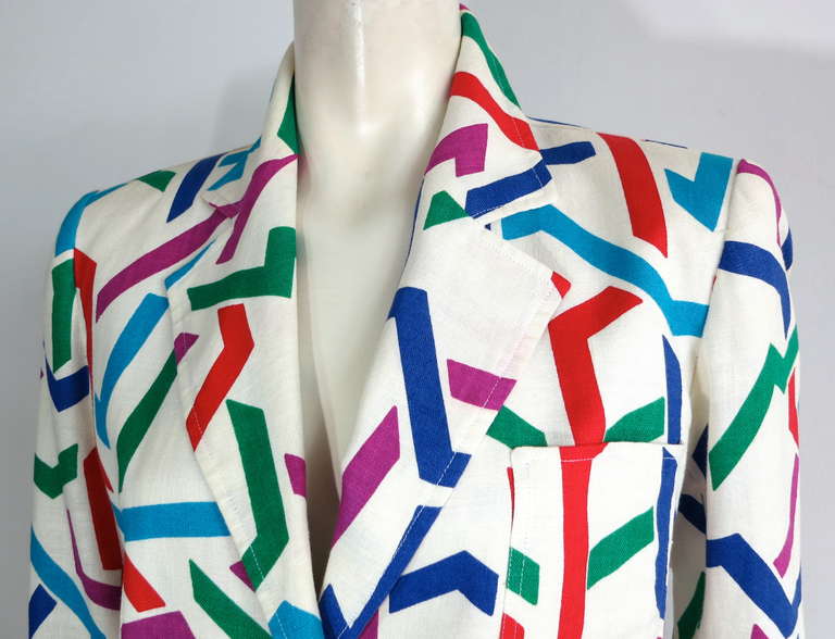 Vintage YVES SAINT LAURENT Printed linen jacket.

This great jacket was designed by Yves Saint Laurent in France, during the late 1970's.

The jacket features a ivory linen base cloth with an all-over, multi-color geometric print.

Two pearl