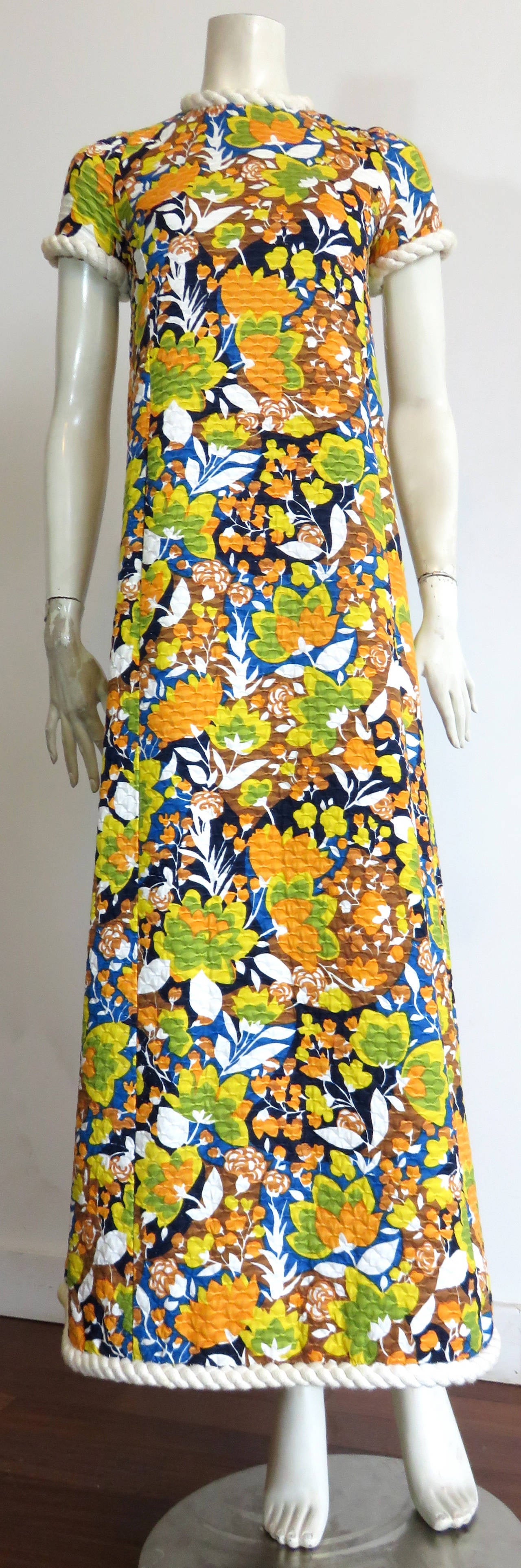 1970's, CHRISTIAN DIOR by Marc Bohan, demi-couture, numbered, hostess dress.

This amazing dress features multicolored floral artwork atop, quilted cotton fabrication. 

The dress is fitted in the shoulders, and flares out beneath, creating a