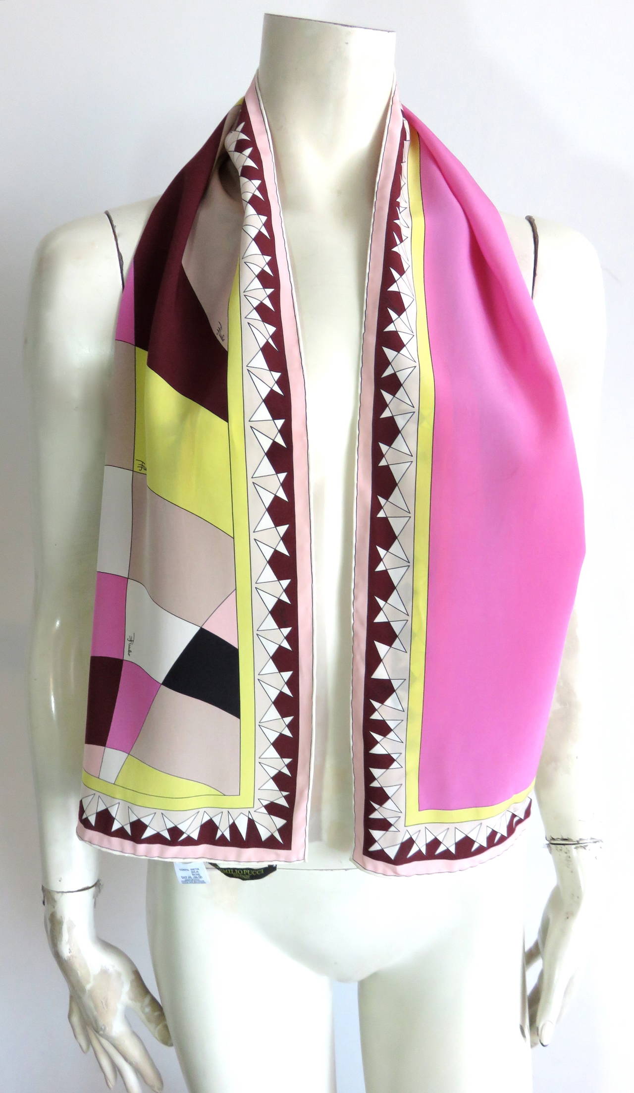 Never used, EMILIO PUCCI Geometric print silk scarf.

Signed, multi-color artwork with angled, 'star' motif border edge.

Hand-rolled edges.

Made in Italy, as labeled.

*MEASUREMENTS*

50