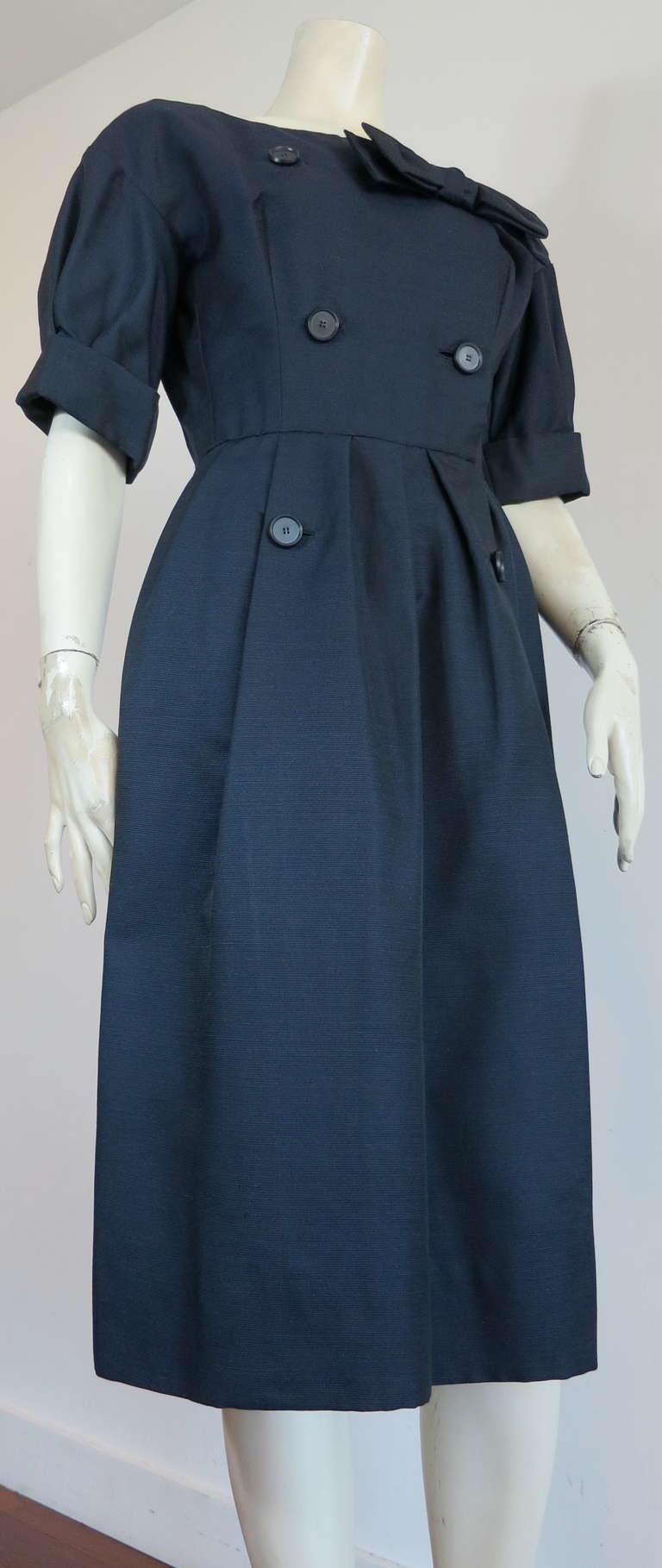 Perfect condition, late 1950's CHRISTIAN DIOR NY silk day dress in dark, midnight blue.  The shell fabric is a horizontal corded weave, and is lined in dark, silk organza.

This wonderful day dress was designed in France for Christian Dior NY