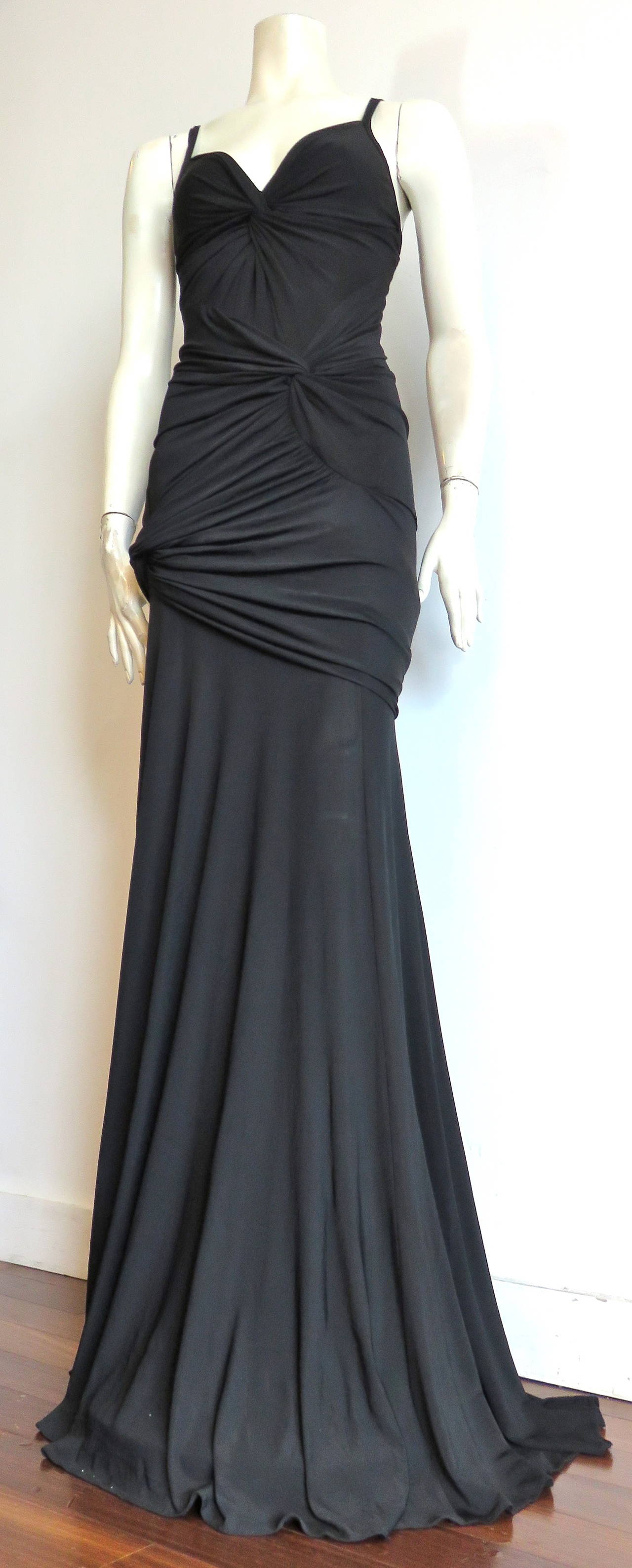 Excellent condition, DONNA KARAN NEW YORK, collection label, black matte jersey, triple-twist evening dress

Full length evening dress with extended train at rear hem

A gorgeously draped, form fitting, evening dress with beautiful twist