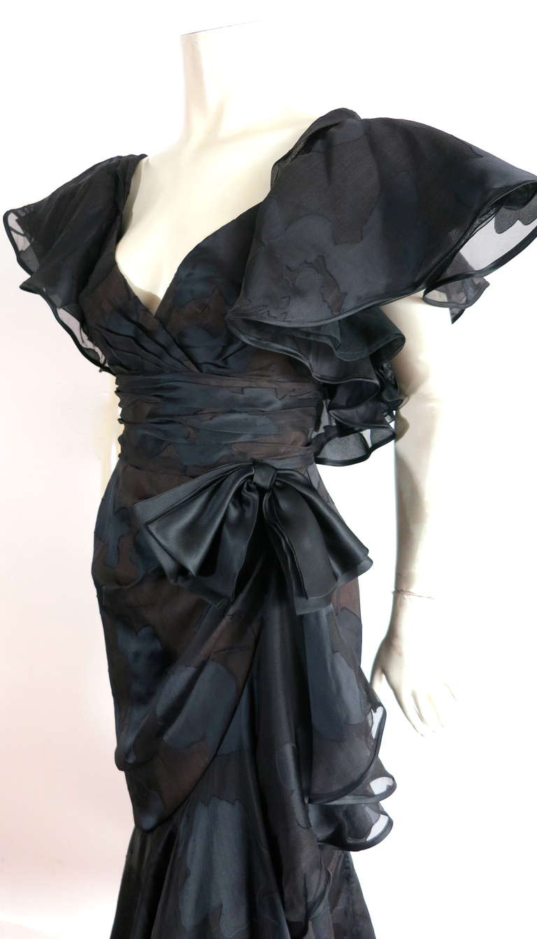 Excellent condition RUBEN PANIS black, silk burnout evening dress featuring a leafy floral, blocked artwork pattern.

This gorgeous evening dress was designed by Ruben Panis during the early 1980's in the USA.

The dress features dramatic