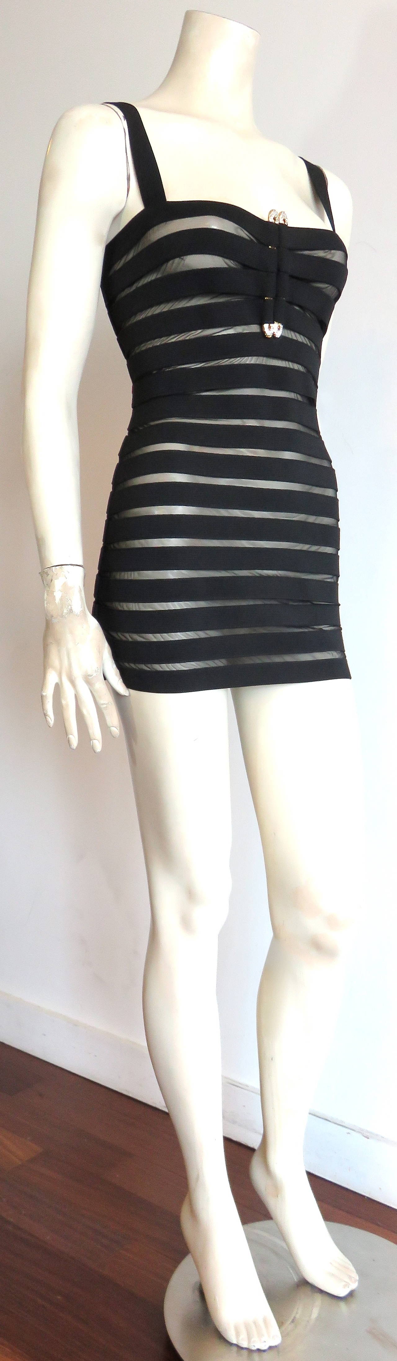 Excellent condition, 1980's GIANFRANCO FERRE, semi-sheer bandage mico-mini dress.

This sexy, semi-sheer, elastic dress can be worn in several ways.  It can be worn over swimwear as a chic, poolside 'cover-up', or over tight leggings, and a tube