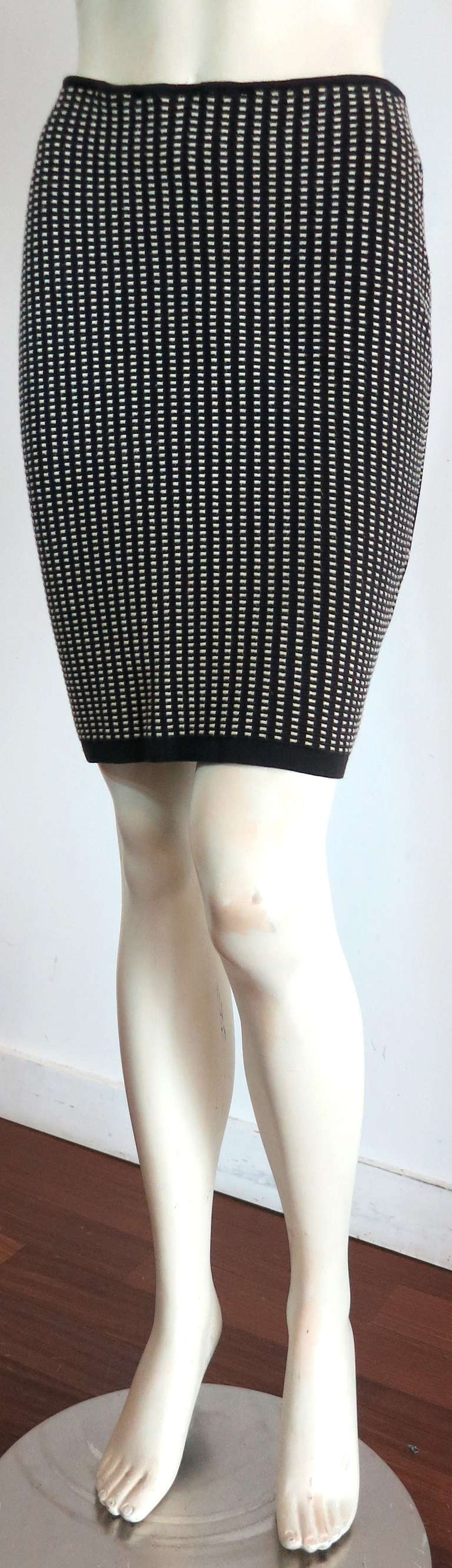 Vintage ALAIA Knit skirt featuring black ribbed base with white dash striped patterning.

This great skirt was designed by Azzedine Alaïa during the 1990's in France.

Sexy, body-con silhouette.

Stretchy fabrication.

In good condition with