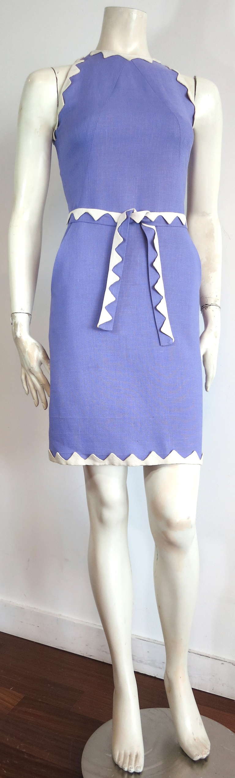 Vintage DONALD BROOKS Linen zig-zag dress & belt.

This great dress was designed by Donald Brooks in New York, during the 1970's.

The ivory, linen zig-zag applique borders are hand-sewn atop the lavender dress base and matching belt.

The