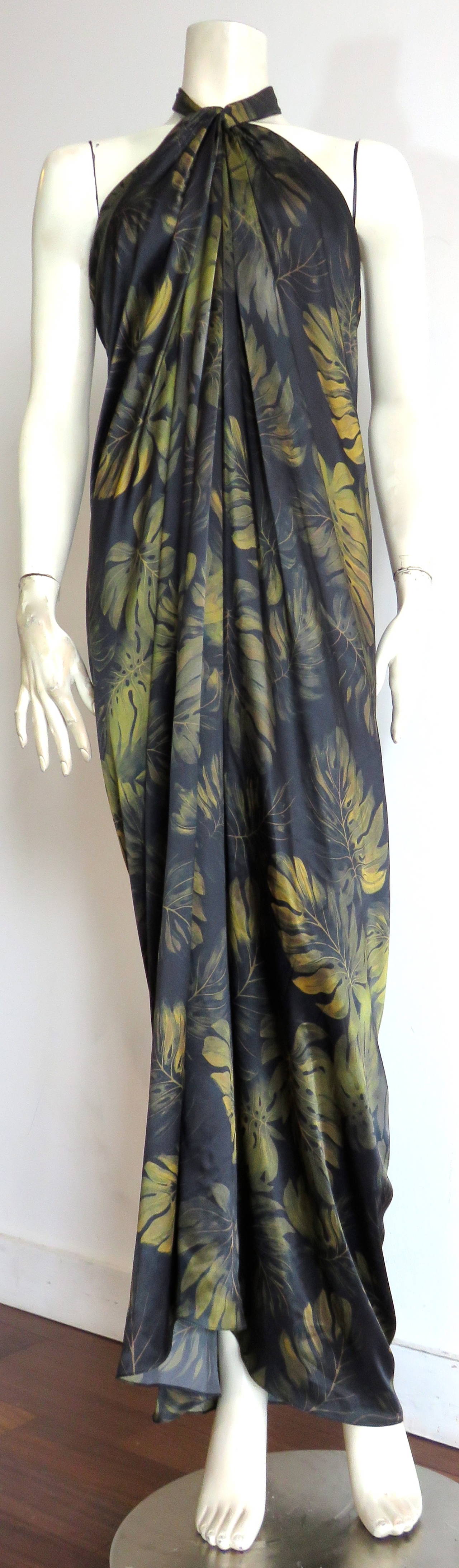 Never worn, LANVIN by Alber Elbaz, 100% silk, palm-print halter neck dress.

Painted palm leaf artwork in deep shades of dark green, and black.

Luxuriously soft, silk charmeuse fabrication.

Adjustable, halter-neck sash ties with twisted
