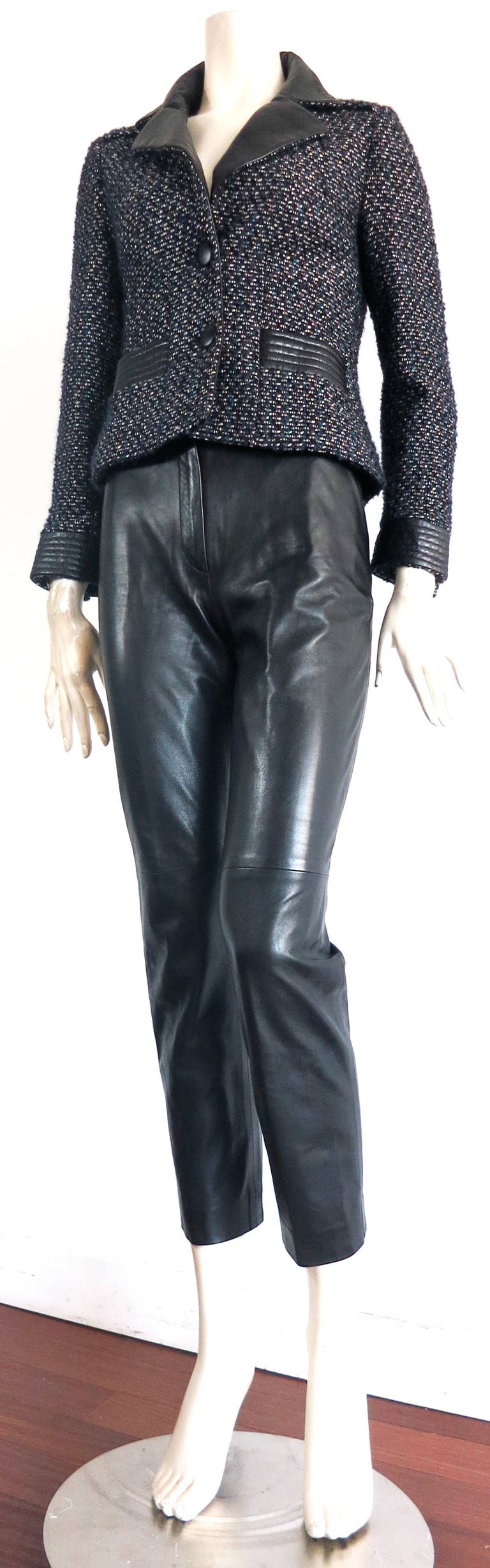 Amazing CHANEL PARIS Lambskin leather & tweed 2pc. pant suit.

This great 2pc. jacket and pant set was designed by Karl Lagerfeld for Chanel during the 2000's in France.

The jacket features a gorgeous tweed fabric of dark aubergine, metallic