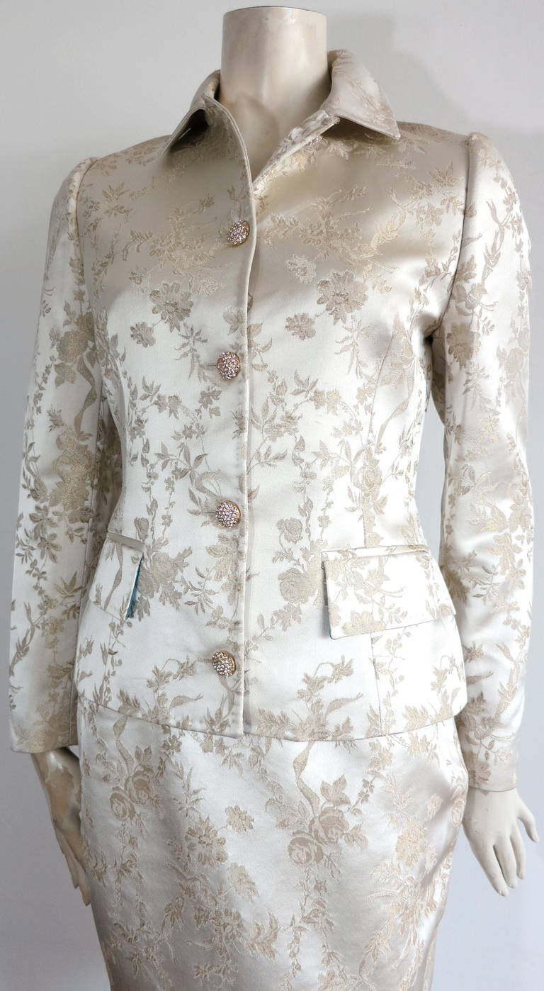 Like new, DOLCE & GABBANA Satin floral brocade, evening skirt suit in pearlescent, ivory base with metallic gold, woven floral pattern.

This stunning skirt suit set was worn once, and is in like new condition with absolutely no signs of wear or