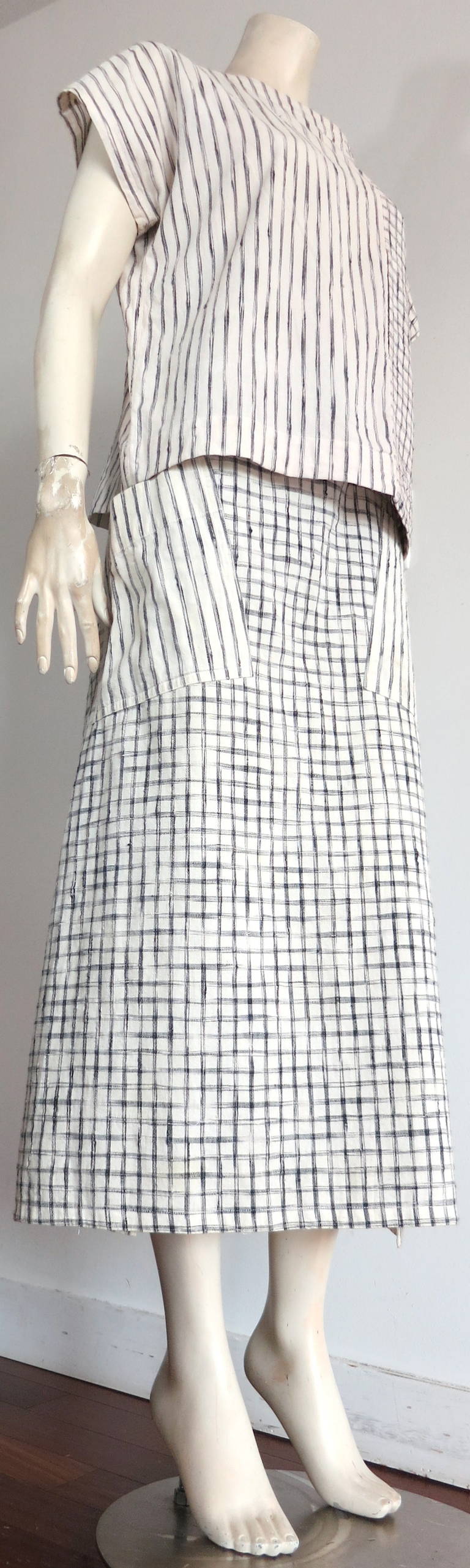 1980's ISSEY MIYAKE Plantation woven ikat 2pc. skirt set.

This wonderful 2pc. skirt and top set was designed by Issey Miyake in Japan during the 1980's under his Plantation label.

Natural woven, cotton & linen, Ikat style stripes and checks