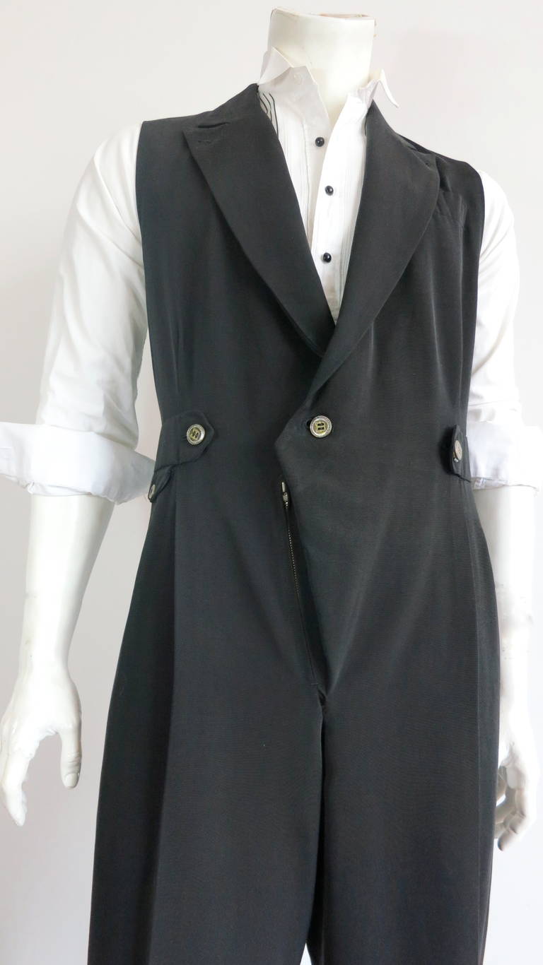 Amazing MATSUDA Men's tailored jumpsuit.

This exceptional menswear jumpsuit was designed by Mitsuhiro Matsuda in Japan during the 1980's.

Peak lapel front with gusseted zipper, fly-front construction.

Dual, side waist tabs with intricate