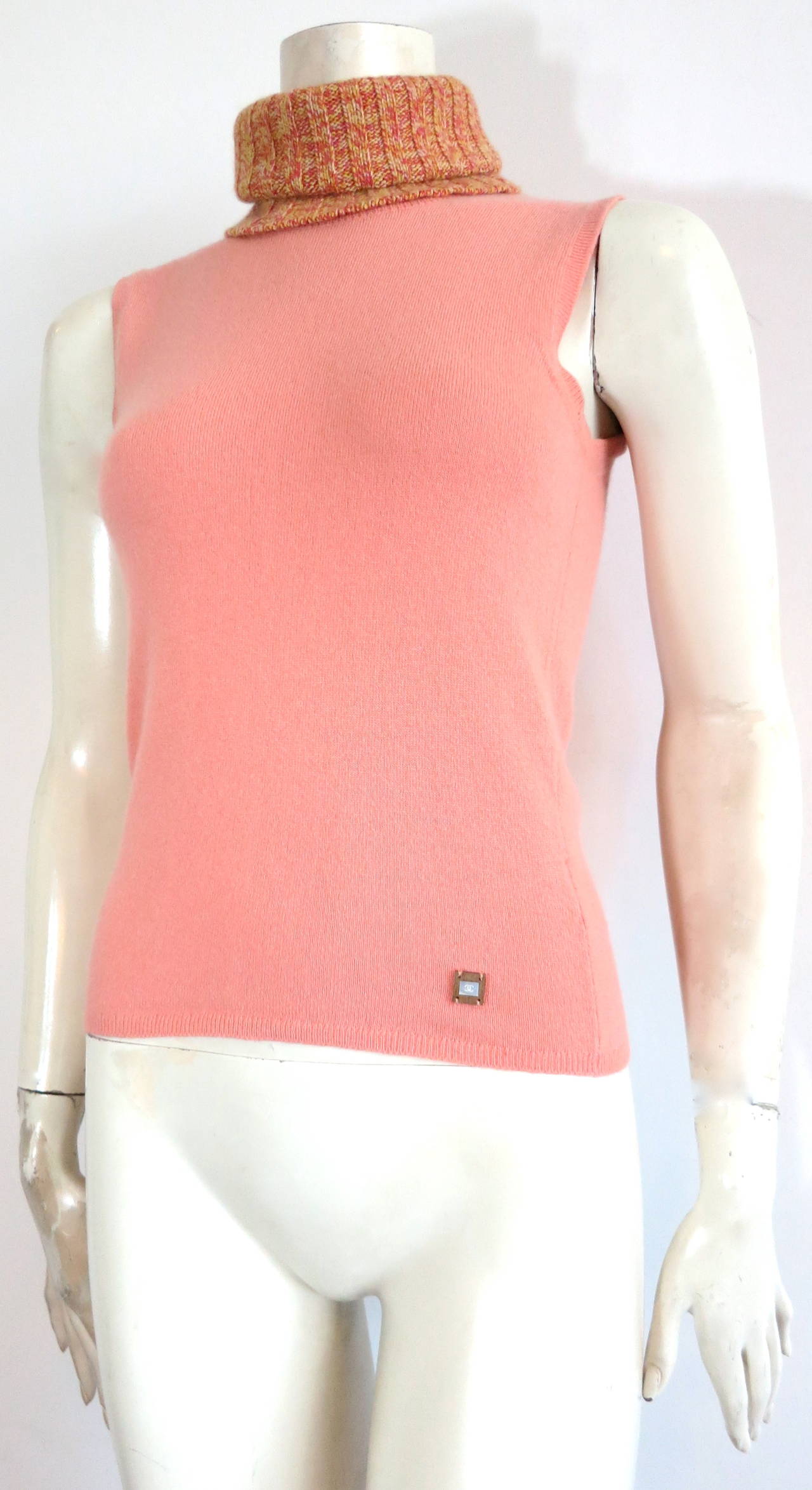 Excellent condition, CHANEL PARIS, pure apricot cashmere, sleeveless turtle-neck sweater.

Luxuriously soft hand-feel with beautiful, multi-color, melange ribbed, sweater knit neck panel.  The neck panel is 12
