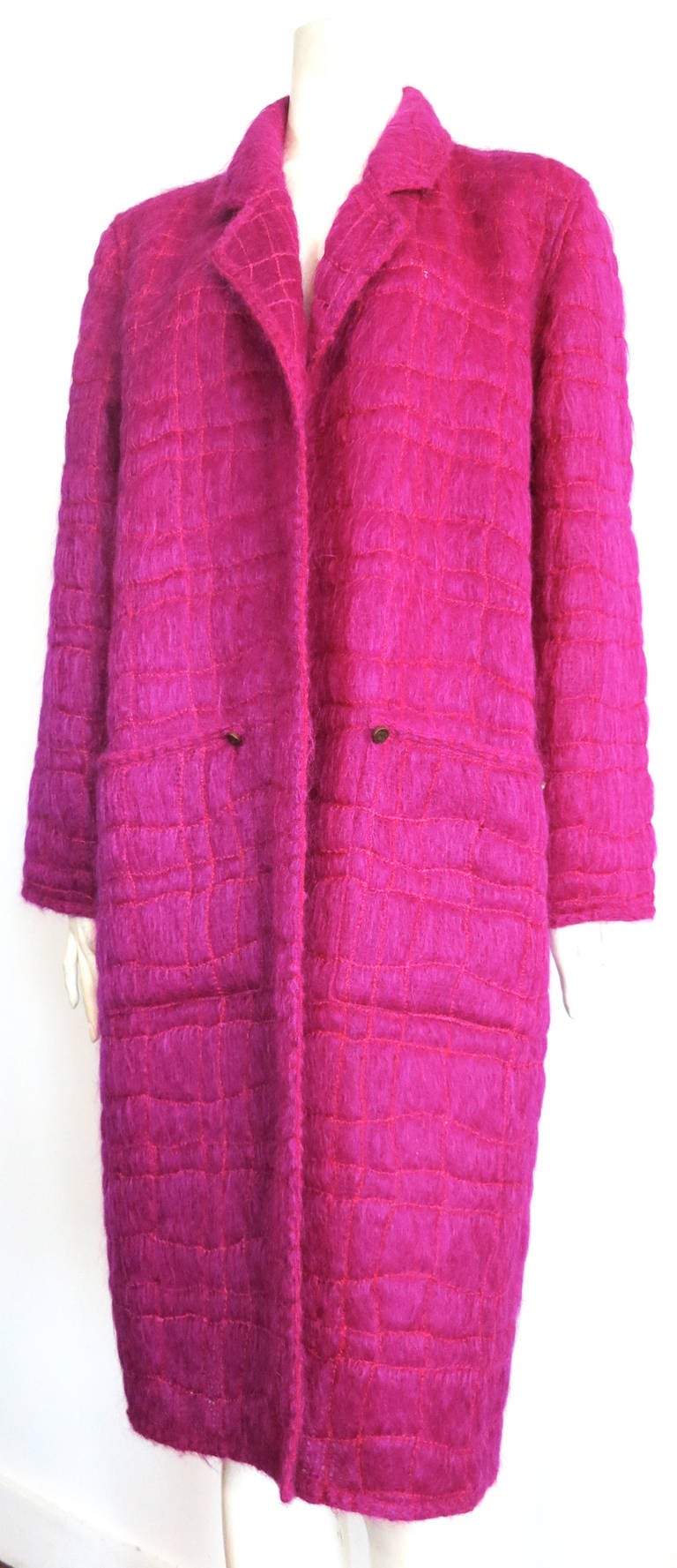 Mint condition CHANEL PARIS Mohair/wool, open front coat.

This gorgeous coat was designed by Karl Lagerfeld for Chanel Paris in France, as labeled.

The coat features light-weight, airy, mohair fabric with an all-over chain-stitched patterning.