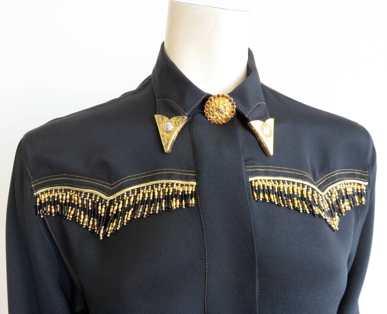 Excellent condition, 1992 GIANNI VERSACE COUTURE, beaded, silk western-style shirt.

Pure, black, silk fabrication with incredible, 'Medusa' logo engraved, metal hardware, collar tips encircled with mini genuine crystals.

Oversized, dazzling,