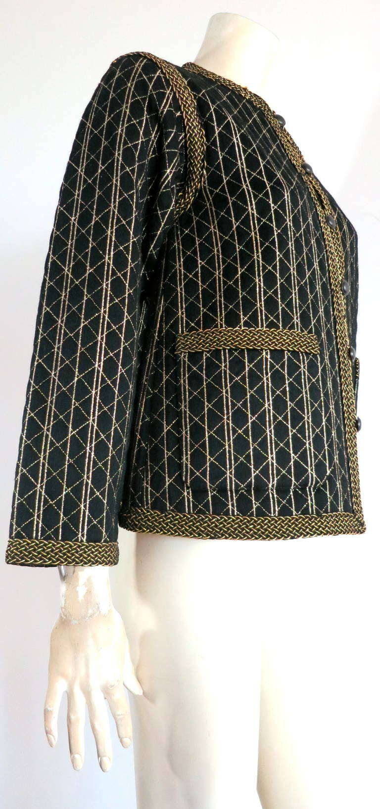 1970s YVES SAINT LAURENT Embroidered, Russian Collection jacket with braided trim.

The soft black wool shell features an all-over diamond quilt stitch pattern with embroidered striped repeat patterning.  

Exquisite metallic gold and black