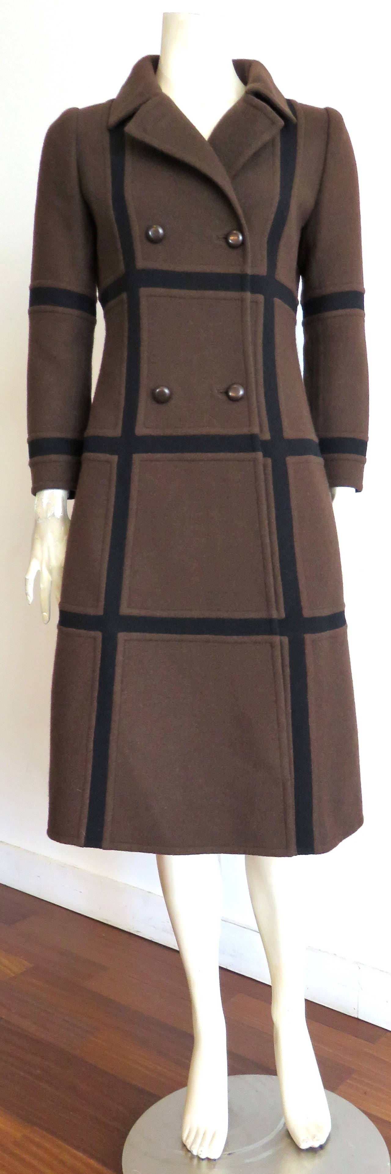 Excellent condition, 1970's, GIVENCHY, haute-couture, wool paneled coat.

This incredible, haute-couture coat features square-shaped, seam-cut, paneling in chocolate brown, and black wool.

Double-front button opening.  The coat has a fitted