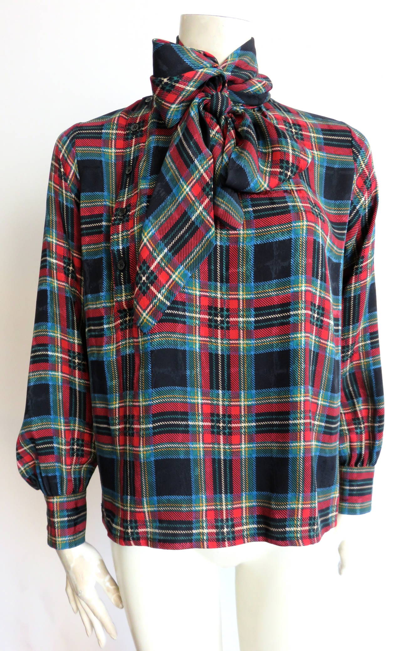 Excellent condition, 1970's, YVES SAINT LAURENT, plaid, silk blouse with 'pussy-cat bow' tie at the front neck.

Button down placket at the wearer's right front.

Loose fit silhouette.

Made in France, as labeled.

In excellent condition
