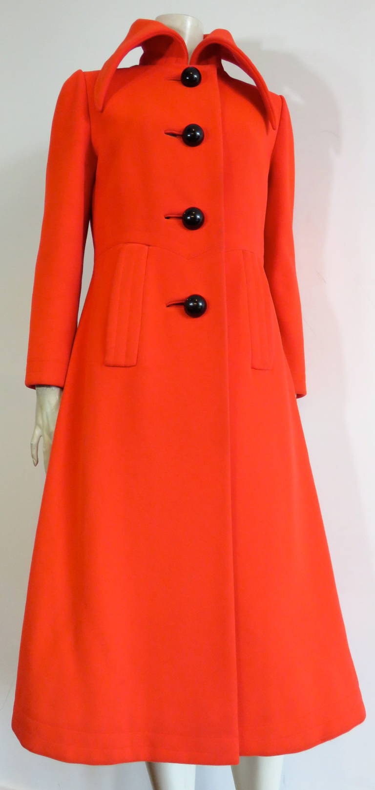 Amazing, 1960's PIERRE CARDIN Mod wool coat with oversized, black dome button closures.

The coat was designed by Pierre Cardin during the 1960's in France.

*The black leather belt in two of the photos is not original to the coat, but will be