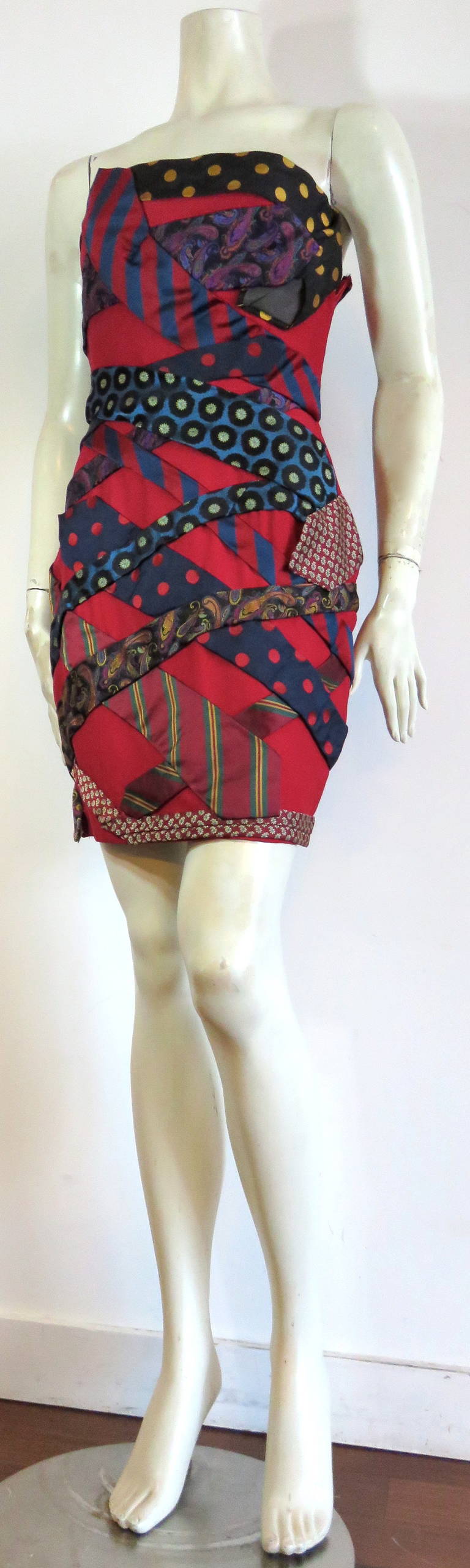 Excellent condition, 1980's MOSCHINO COUTURE vintage silk tie dress.

This rare dress was designed by Franco Moschino during the 1980's in Italy.

The dress is made of a dark red, silk base fabric with vintage, Moschino, silk ties interwoven