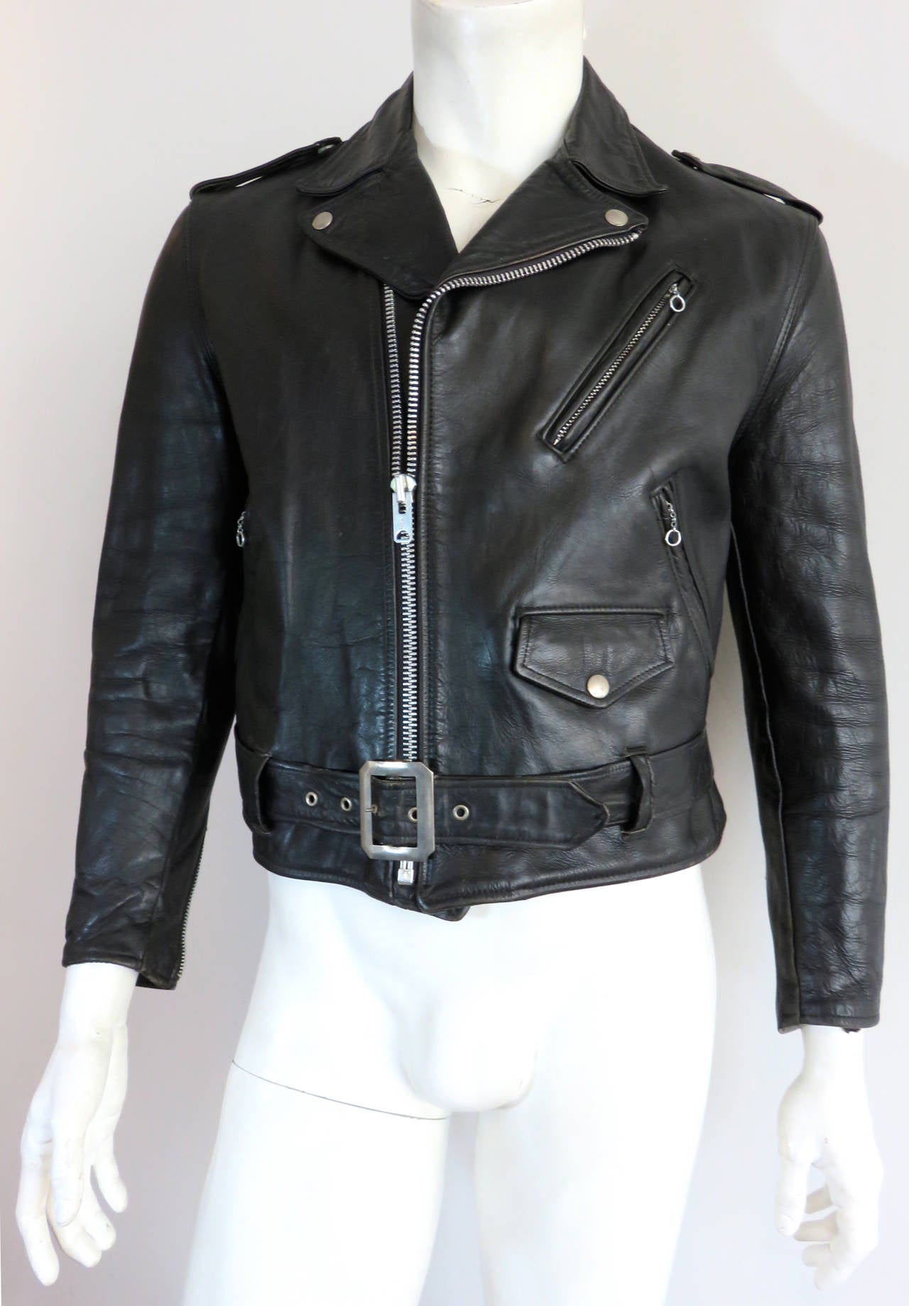 Great condition, 1960's SCHOTT BROS. USA Men's Perfecto leather motorcycle jacket.

This iconic American jacket features thick, black leather skin, and nickel metal hardware details, all original from the 1960's.  

Talon engraved, zipper front