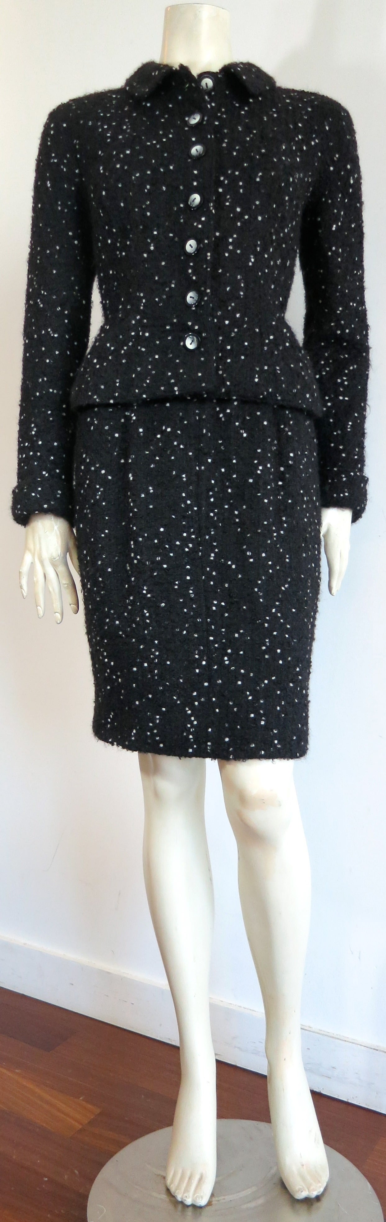 Great condition, 1980's VALENTINO Confetti bouclé 2pc. skirt suit.

Black , wool/mohair, bouclé fabrication with white 'confetti' speckle effects within the fabrication.  

The jacket features twin chest and waist level pockets with self-fabric