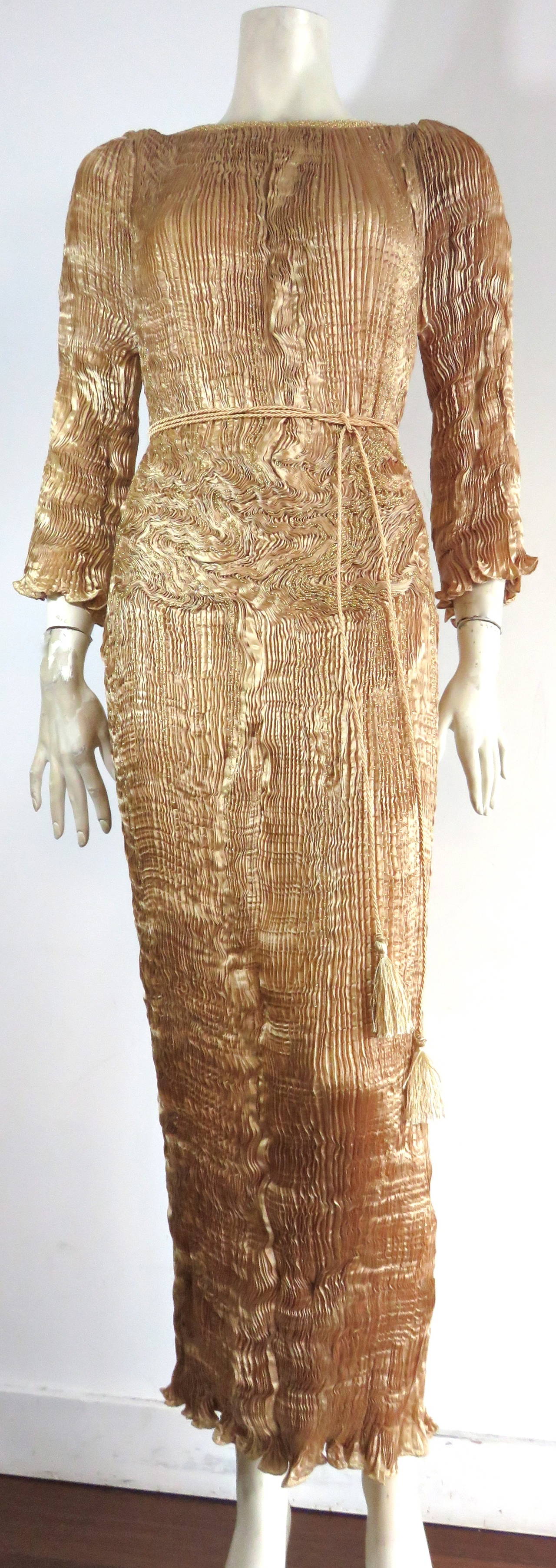 Mint condition, 1980's PATRICIA LESTER, Fortuny-pleated & beaded, 'Delphos' gown in 100% pure, golden silk.

This is really a stunning dress designed by Patricia Lester in Wales during the 1980's, inspired by Mario Fortuny.

The entire dress is