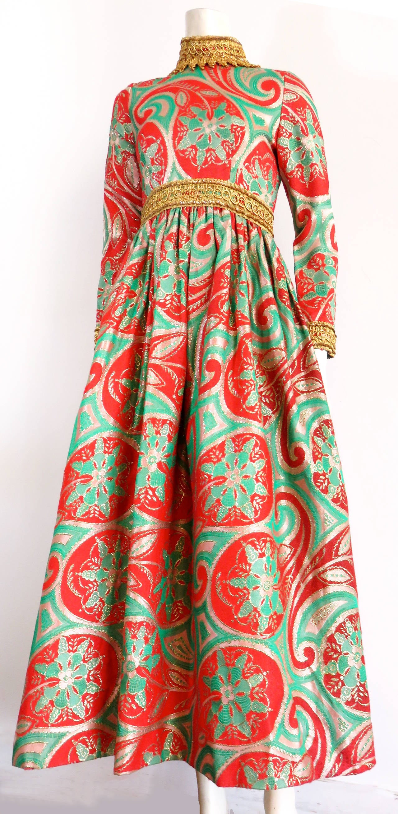 Excellent condition, OSCAR DE LA RENTA, early 1970's metallic brocade paisley dress.  This amazing evening dress is made of a tapestry weave brocade featuring a large scale paisley floral pattern in poppy red, jade green, and metallic gold.  There