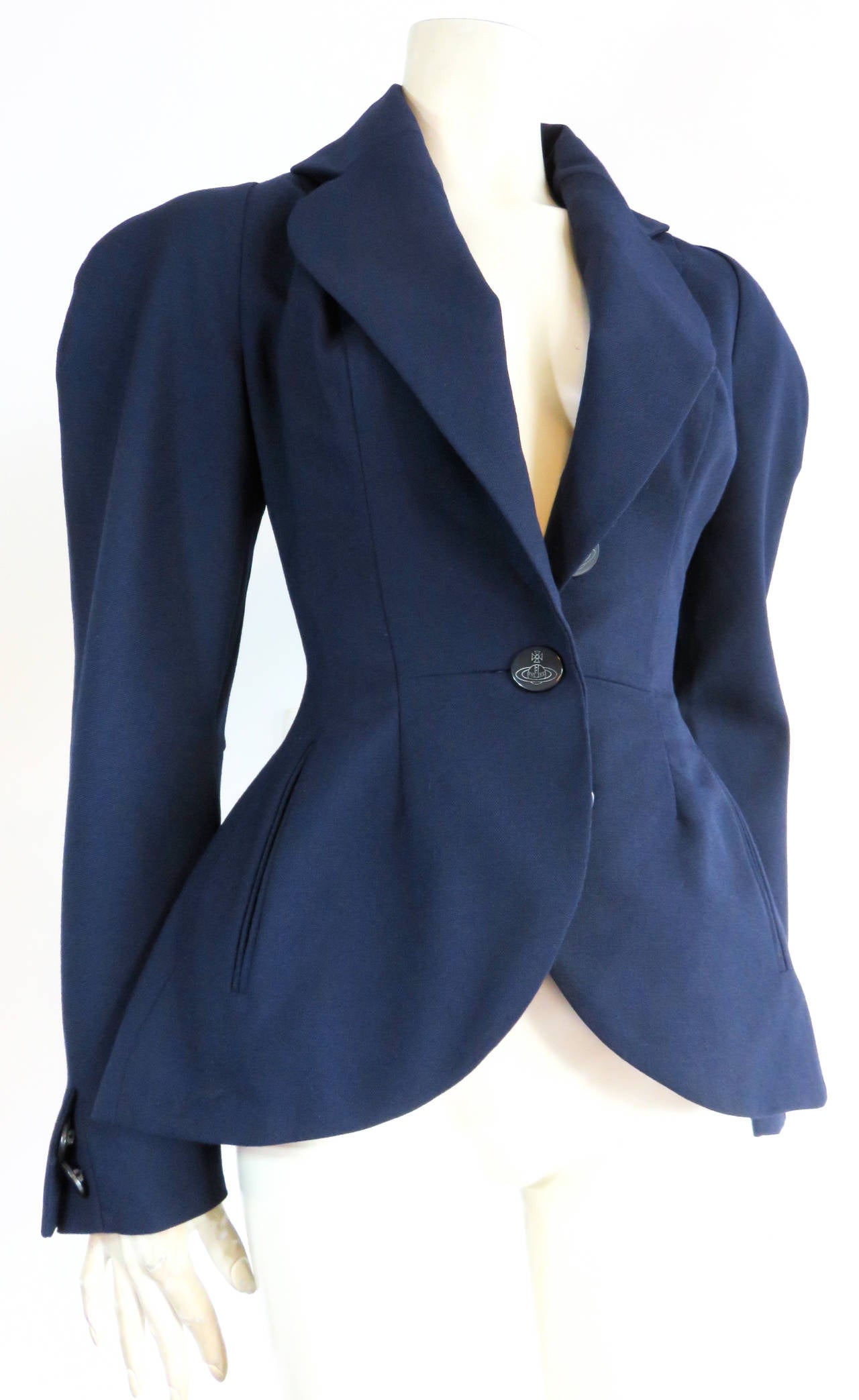 Worn once, like new VIVIENNE WESTWOOD GOLD LABEL navy blue, worsted wool blazer.

Canvas weave fabrication made from Martin & Sons Co. wool from Huddersfield England, as labeled.

Victorian inspired, 'wasp waist' silhouette jacket with logo