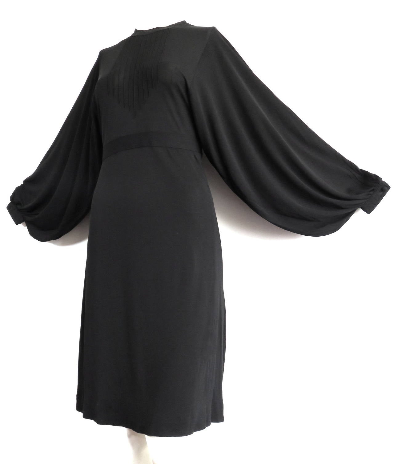 Excellent condition, early 1970's JEAN MUIR, Pin-tucked, matte-jersey LBD.

The dress features gorgeous, volume shaped sleeves.  The armholes of the sleeves start at the shoulder, and open all the way down to the waist, similar to a kimono sleeve