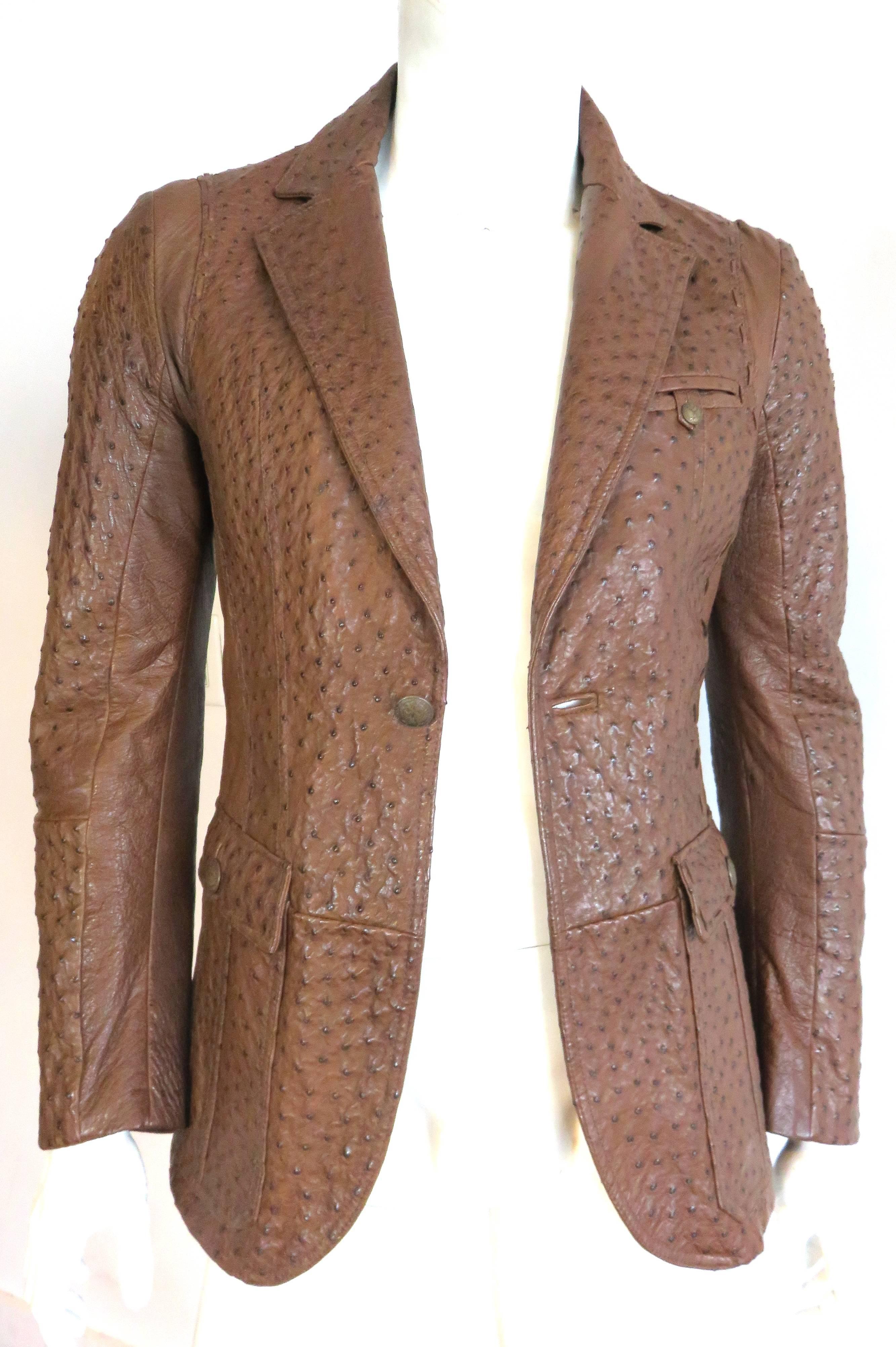 Luxurious, ROBERTO CAVALLI Men's cognac ostrich skin leather blazer jacket.

Genuine, full-quill ostrich skin leather jacket with seamed panel construction.

Leather lacing, stitch detailing around top of armholes, and down side seam