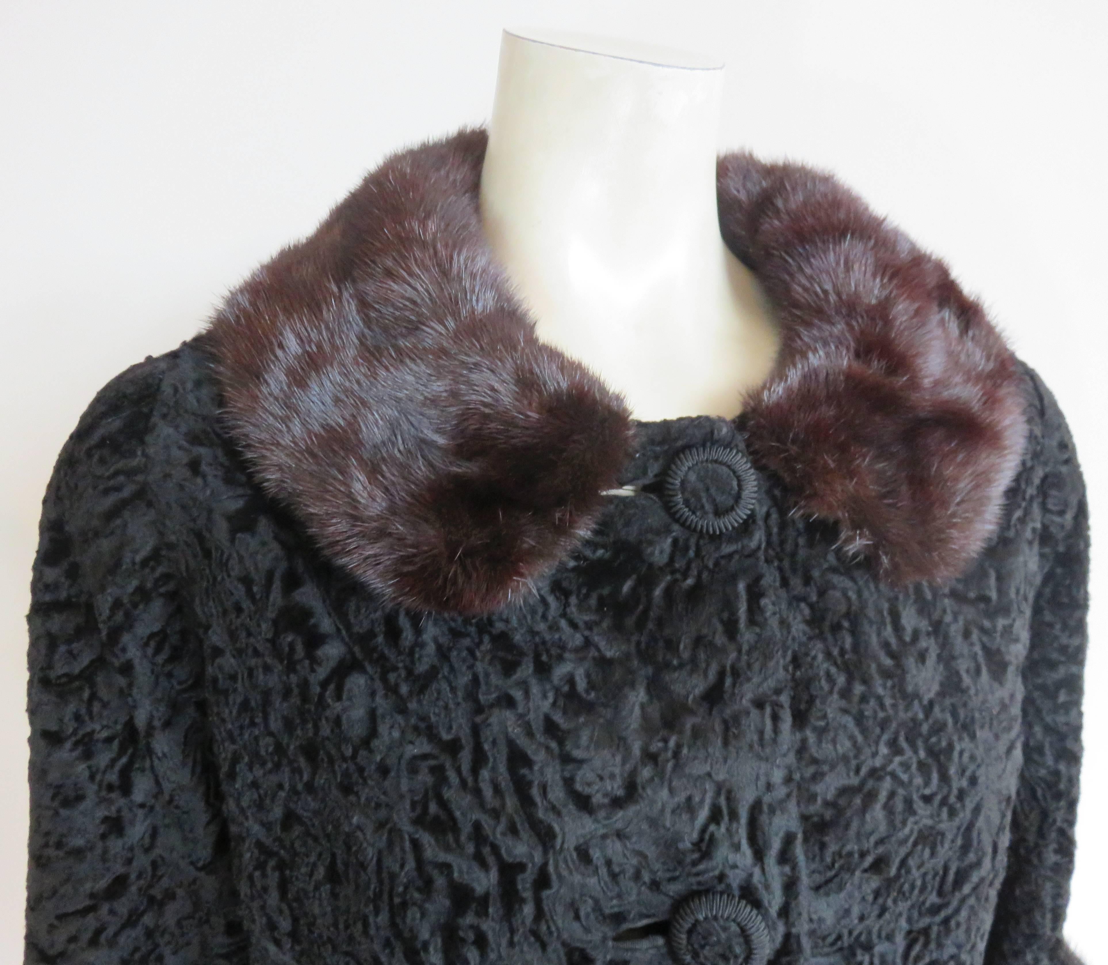 Mint condition 1960's BROADTAIL & MINK FUR JACKET.

Luxurious, black broadtail fur body with with generously sized, mink fur collar, and cuffs.

Three-quarter length sleeves with braided button detailing.

Fully lined, and in excellent