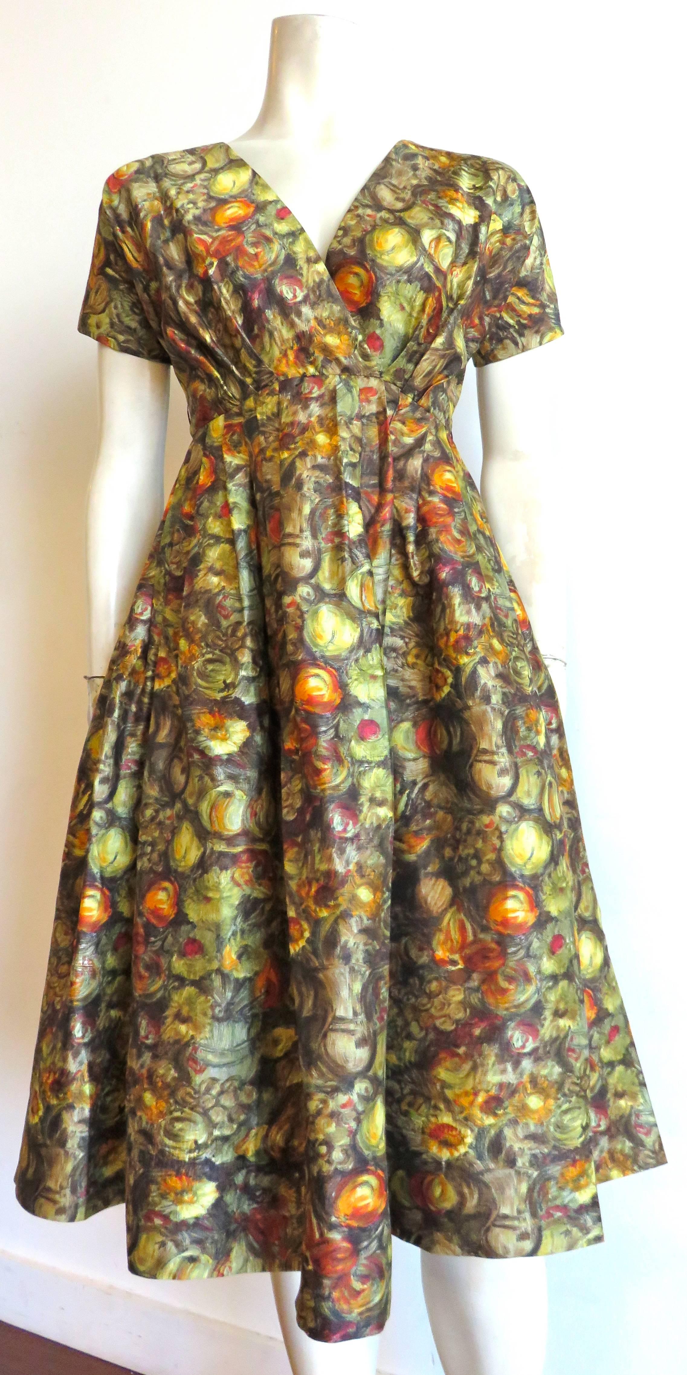 Excellent condition, late 1940's CLAIRE McCARDELL, silk, fruits & flowers cocktail dress.

This stunning dress features an all-over, painted-style, fruits & flowers printed artwork in gorgeous autumnal colors.

Excellent condition, silk