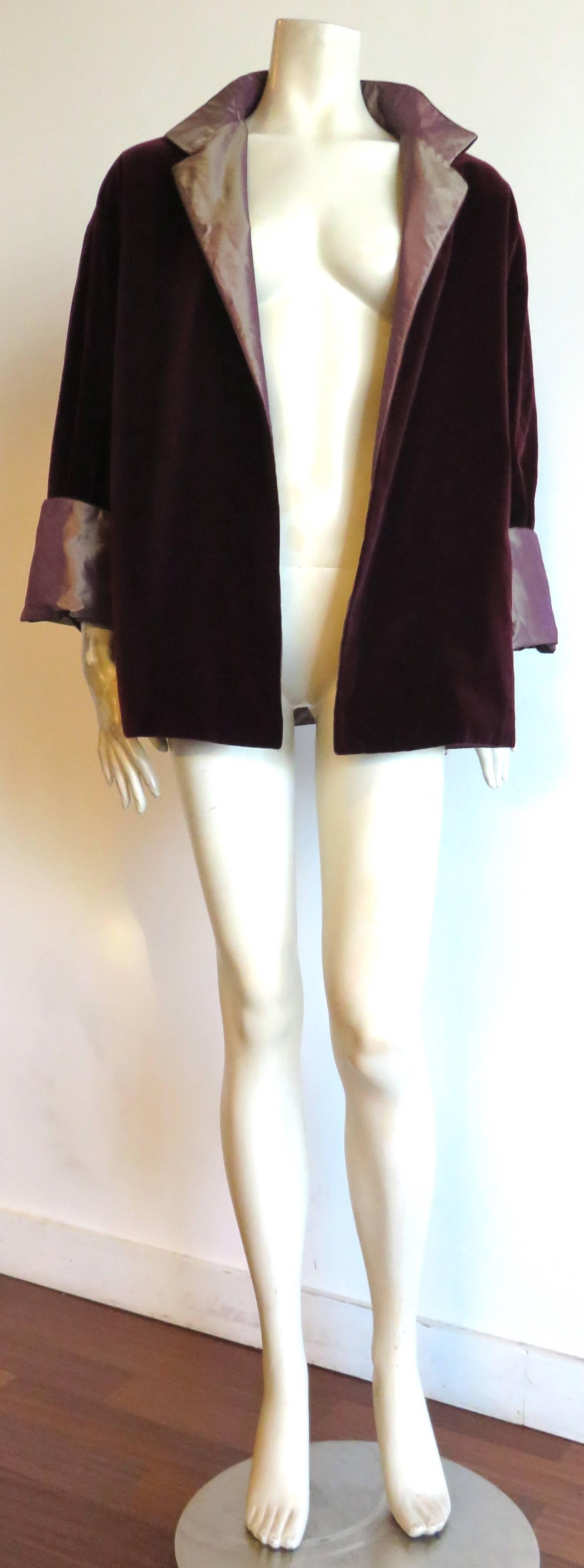 Excellent condition, 1990's ZORAN, reversible dark burgundy, velvet and tonic silk evening jacket.

Open-front, closure-less style, reversible jacket which can be worn on the velvet or taffeta side.

Plush velvet fabrication with no damages, or