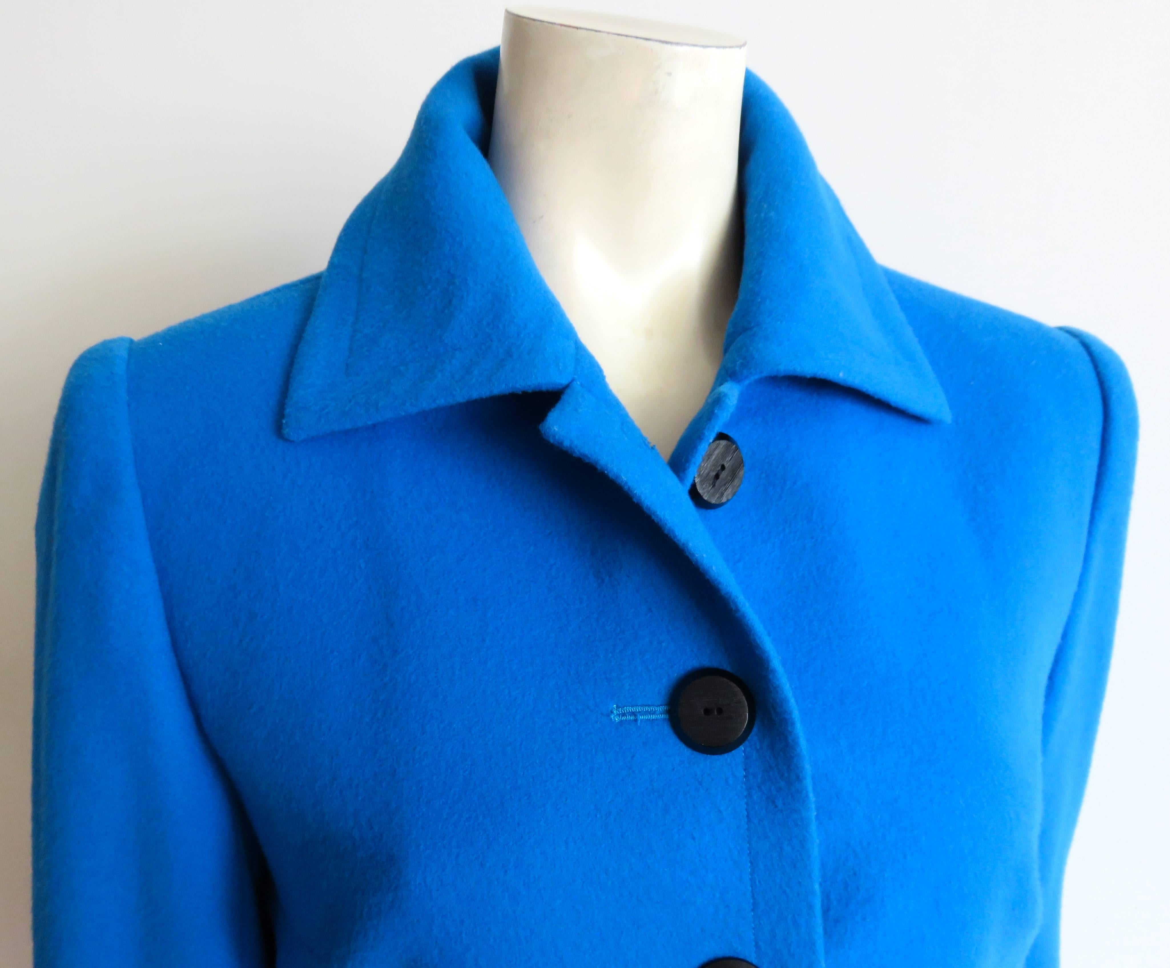 Lovely, and in excellent condition, 1970's YVES SAINT LAURENT, Cerulean wool jacket with scored, black, onyx-style buttons at front opening.

Generously sized collar, and pockets.

Gorgeous, bright, Cerulean blue color.

Fully lined.

Made